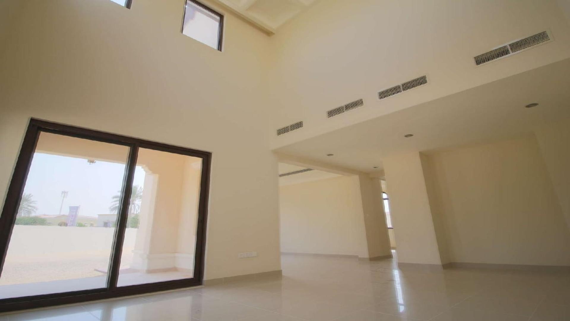 Spacious villa interior with high ceiling and large windows in Rosa, Arabian Ranches 2