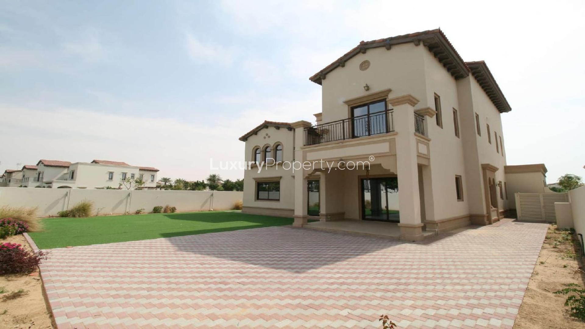 Spacious 4-bedroom villa exterior with green lawn in Rosa, Arabian Ranches 2 for rent