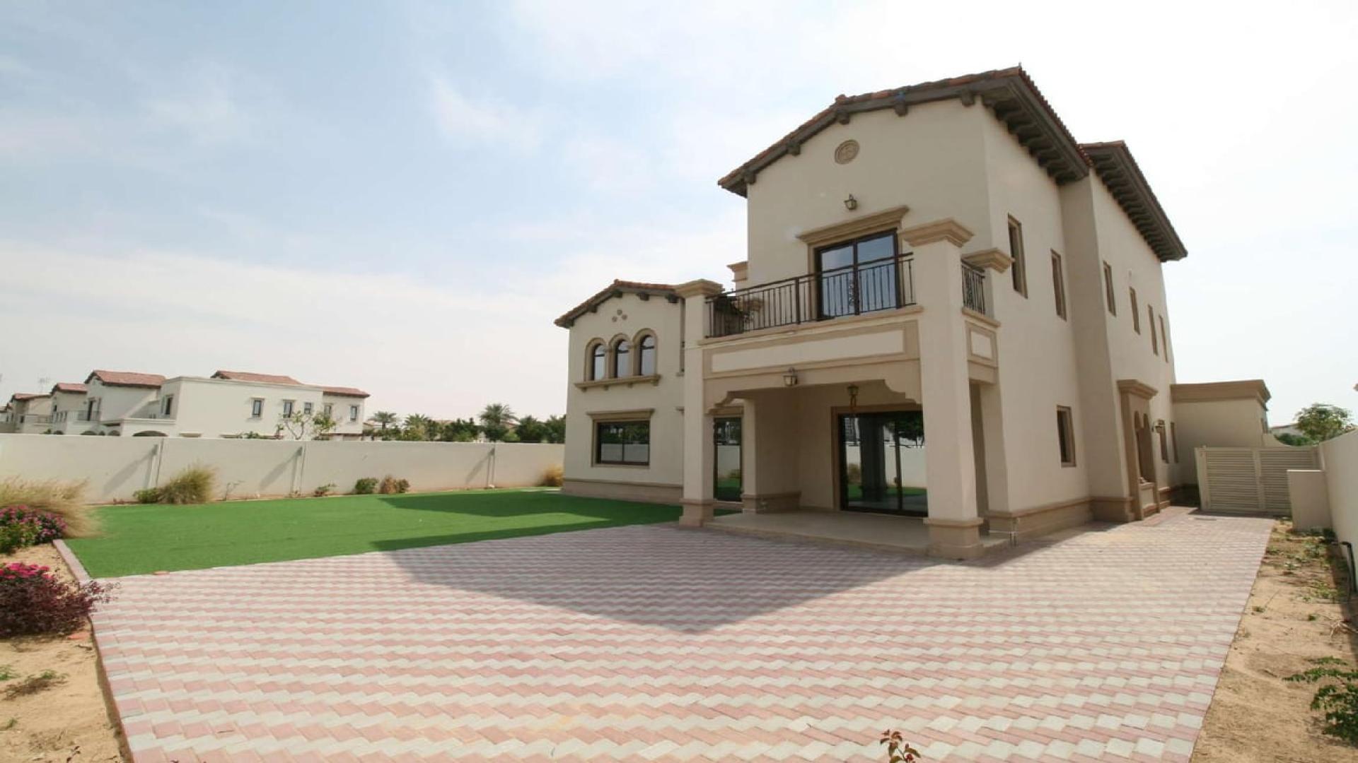 Spacious 4-bedroom villa exterior with green lawn in Rosa, Arabian Ranches 2 for rent