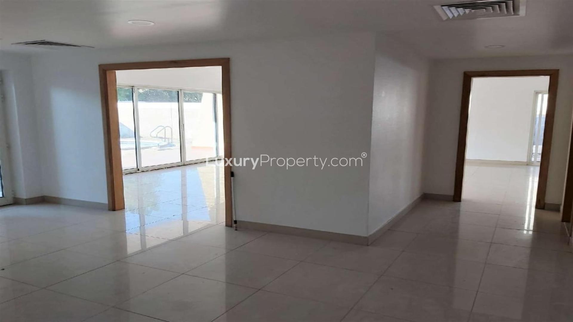 Spacious villa living room with pool view in Al Wasl, available for rent