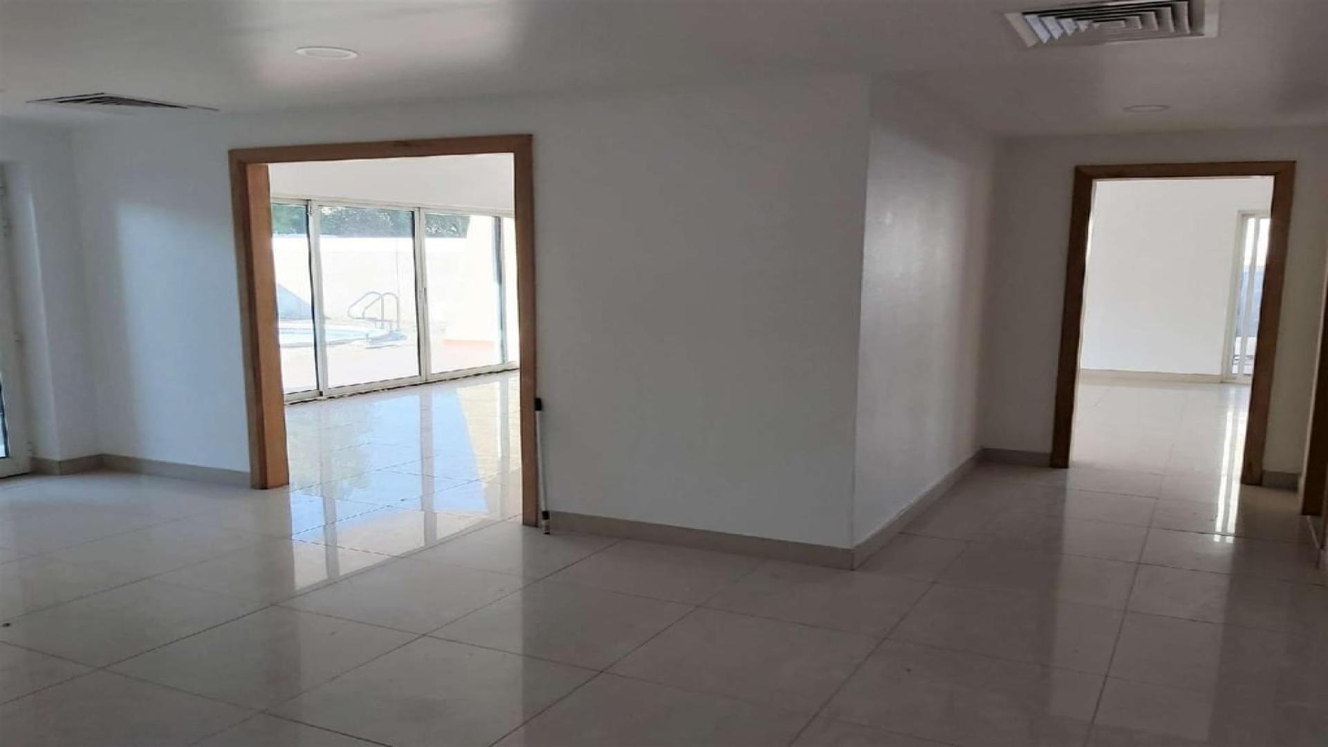 Spacious villa living room with pool view in Al Wasl, available for rent