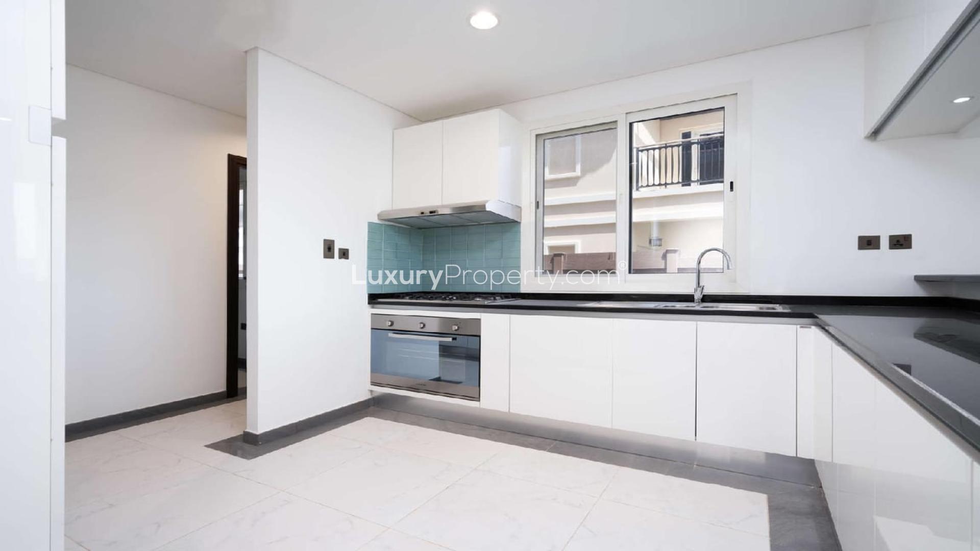 Bright bedroom with balcony view in Al Habtoor Polo Club villa, Dubai Land