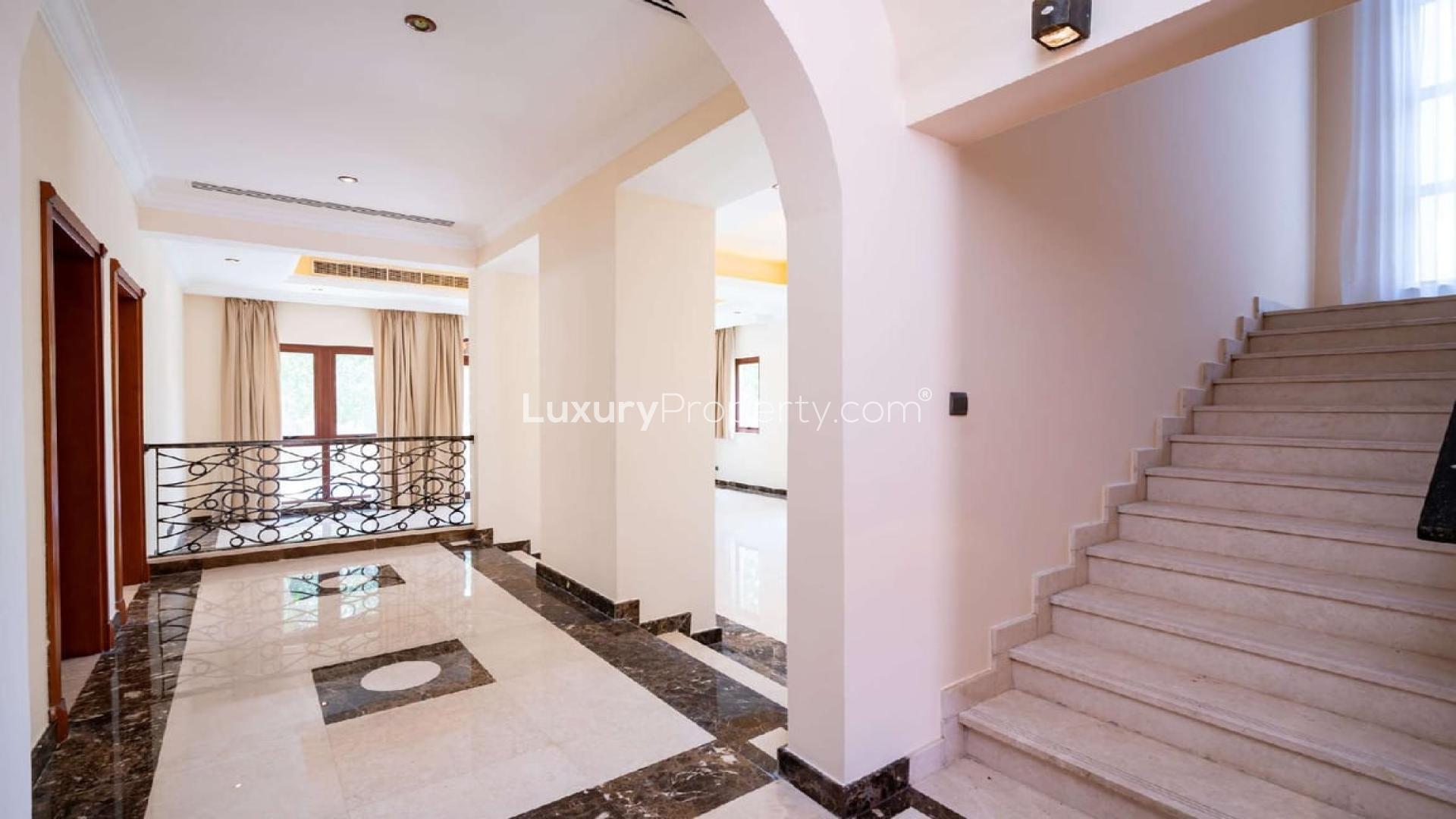 Spacious modern kitchen in 4-bedroom villa, Orange Lake, Jumeirah Golf Estates, with wooden cabinets