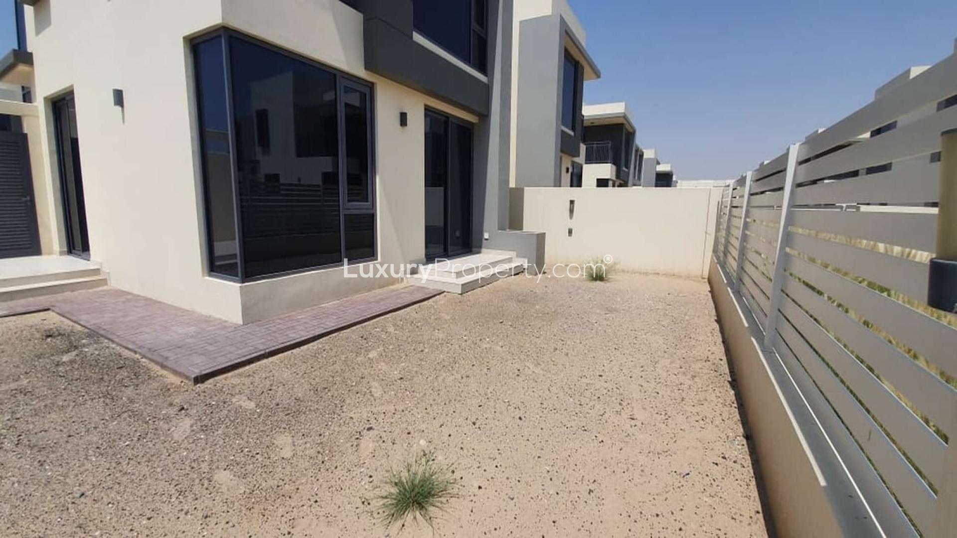 Modern townhouse exterior with patio space in Maple, Dubai Hills Estate