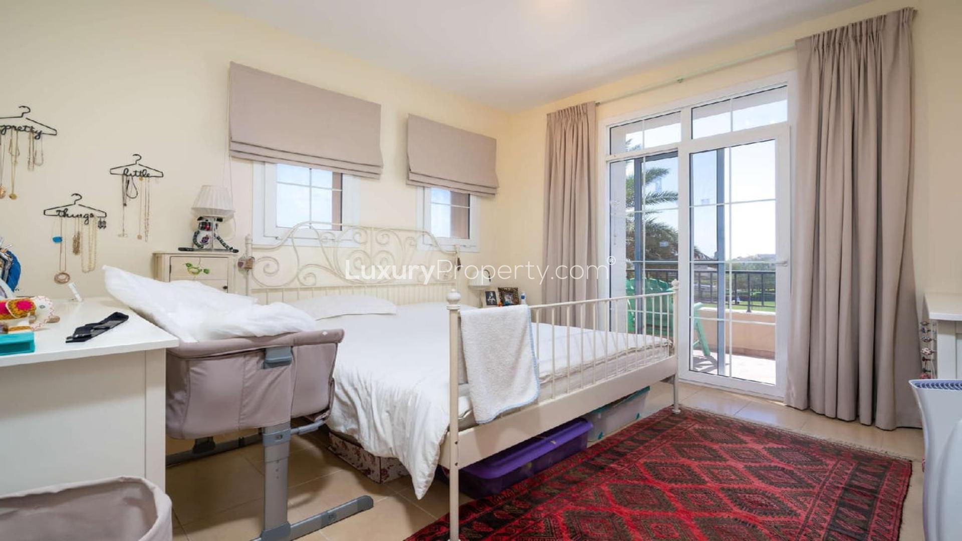 Living room in 4-bedroom townhouse, Alma, Arabian Ranches, featuring modern decor and natural light