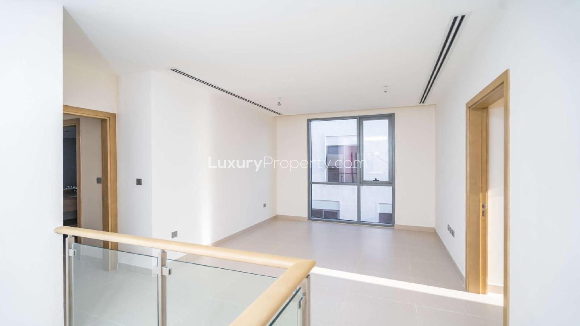 Modern open-plan living area in Sidra Villa, Dubai Hills Estate, with elegant dining setup