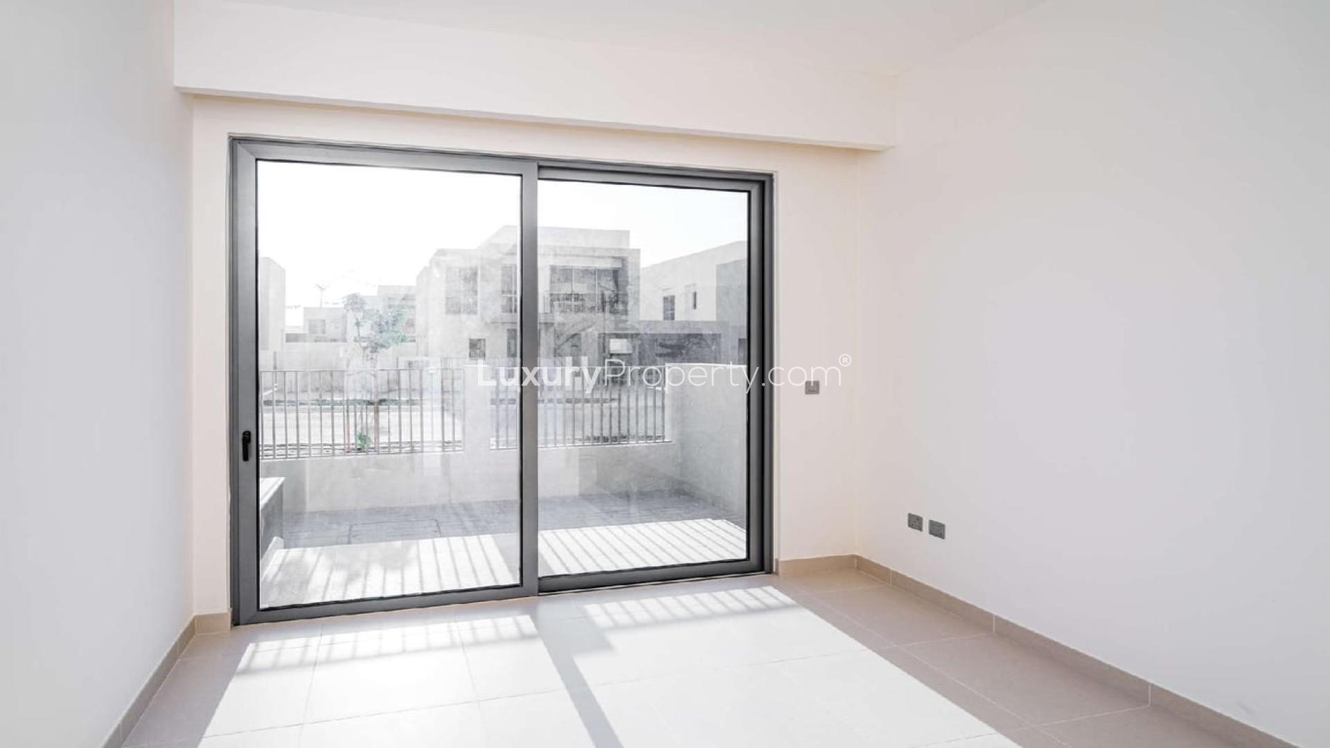 Modern 4-bedroom villa exterior in Sidra Villas, Dubai Hills Estate, with landscaped front yard