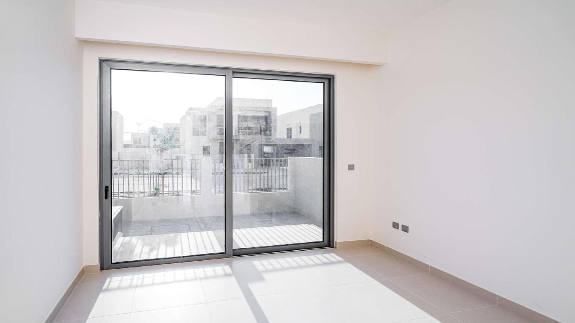 Modern 4-bedroom villa exterior in Sidra Villas, Dubai Hills Estate, with landscaped front yard