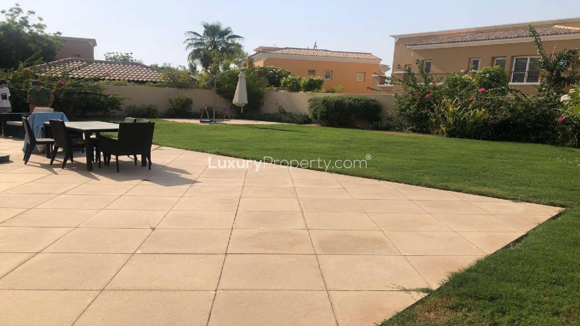Spacious backyard with patio and lawn in Arabian Ranches villa, Mirador La Coleccion