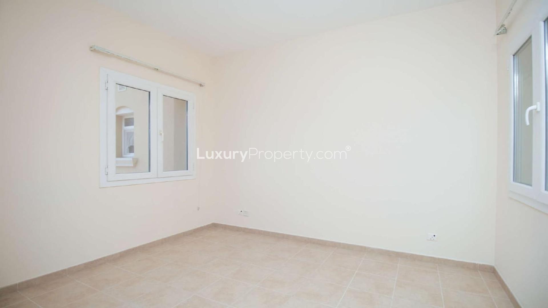 Spacious living area with elegant staircase in 4-bedroom villa, Palmera 3, Arabian Ranches