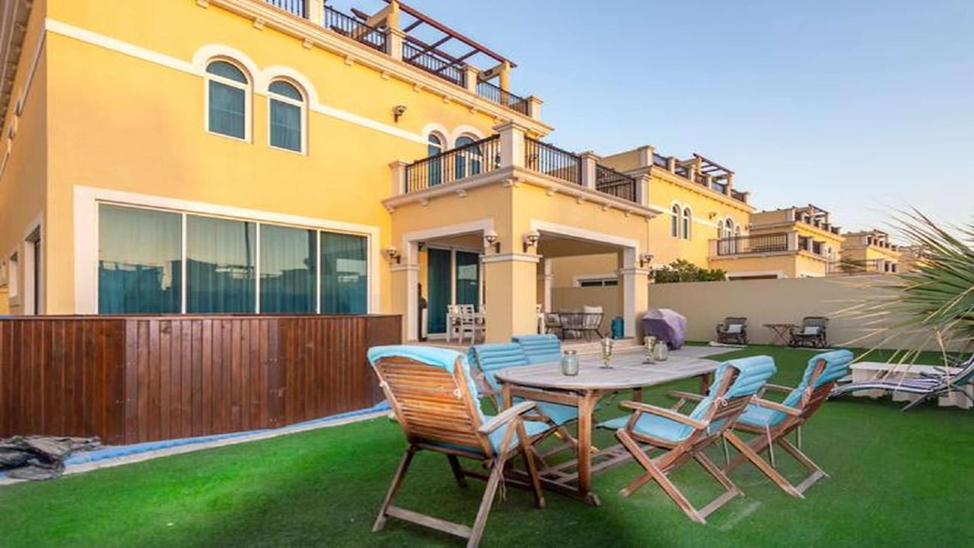 Exterior view of Legacy Nova Villa with patio in Jumeirah Park, available for rent