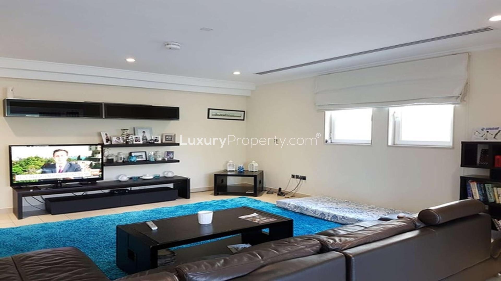 Modern kitchen in 5-bed villa, Jumeirah Park, with wooden cabinets and stainless steel appliances