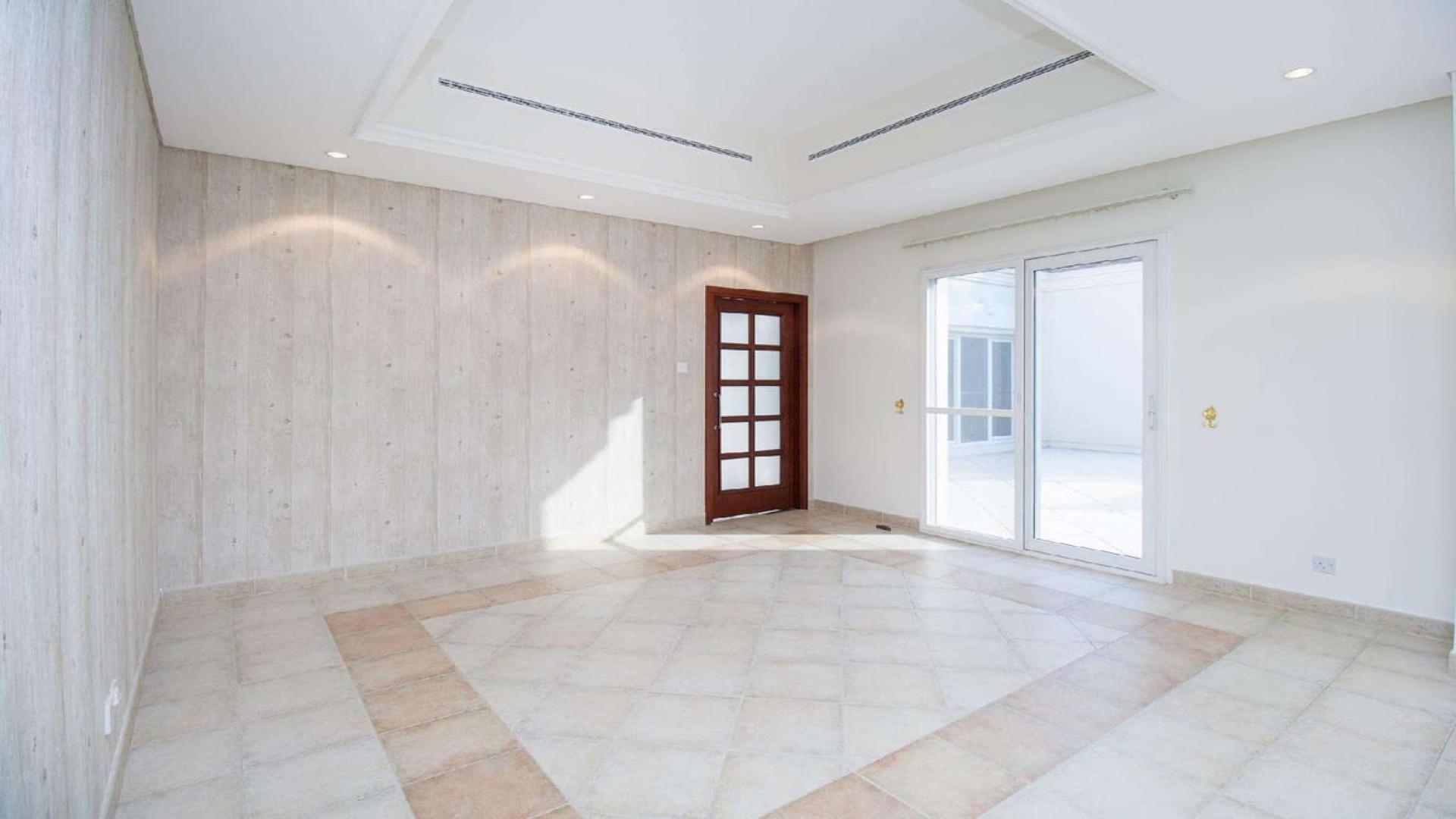 Exterior view of 4-bedroom villa with lush garden in Green Community Motor City