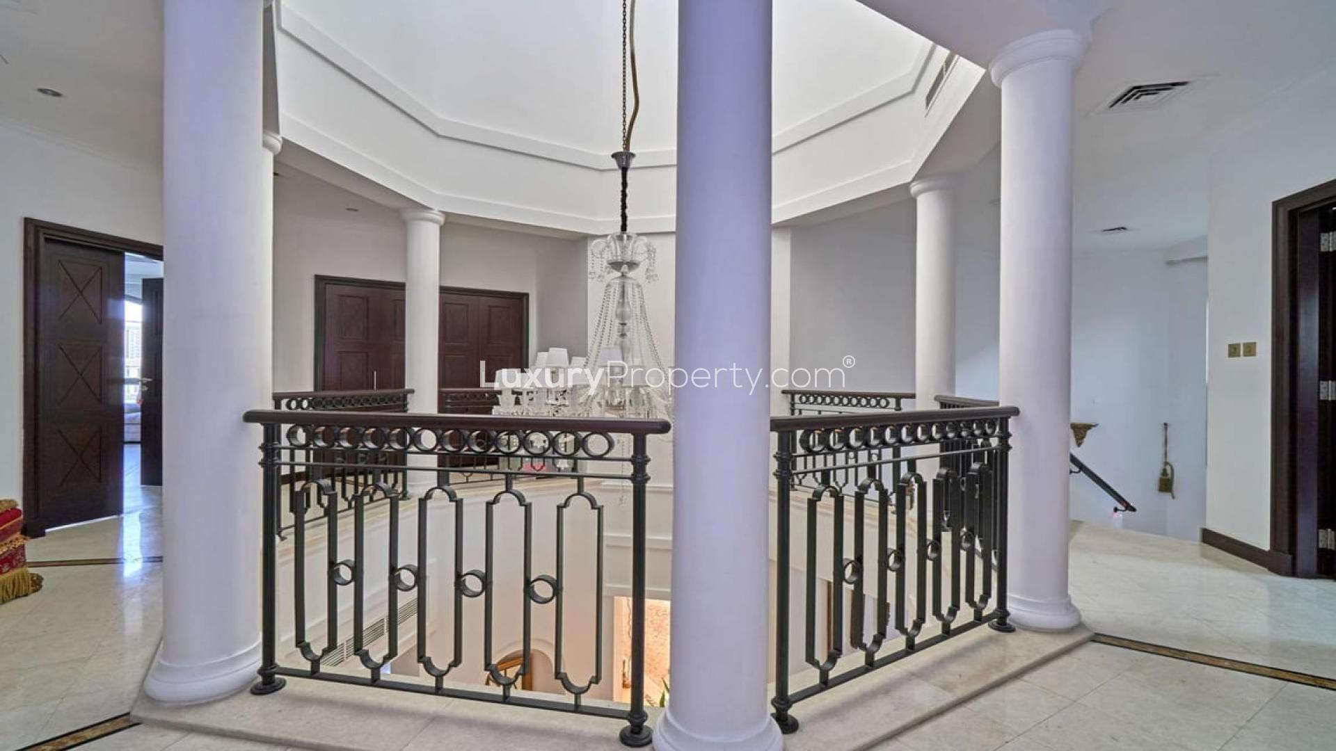 Elegant four-bedroom villa exterior in Palm Jumeirah, Garden Homes, available for rent