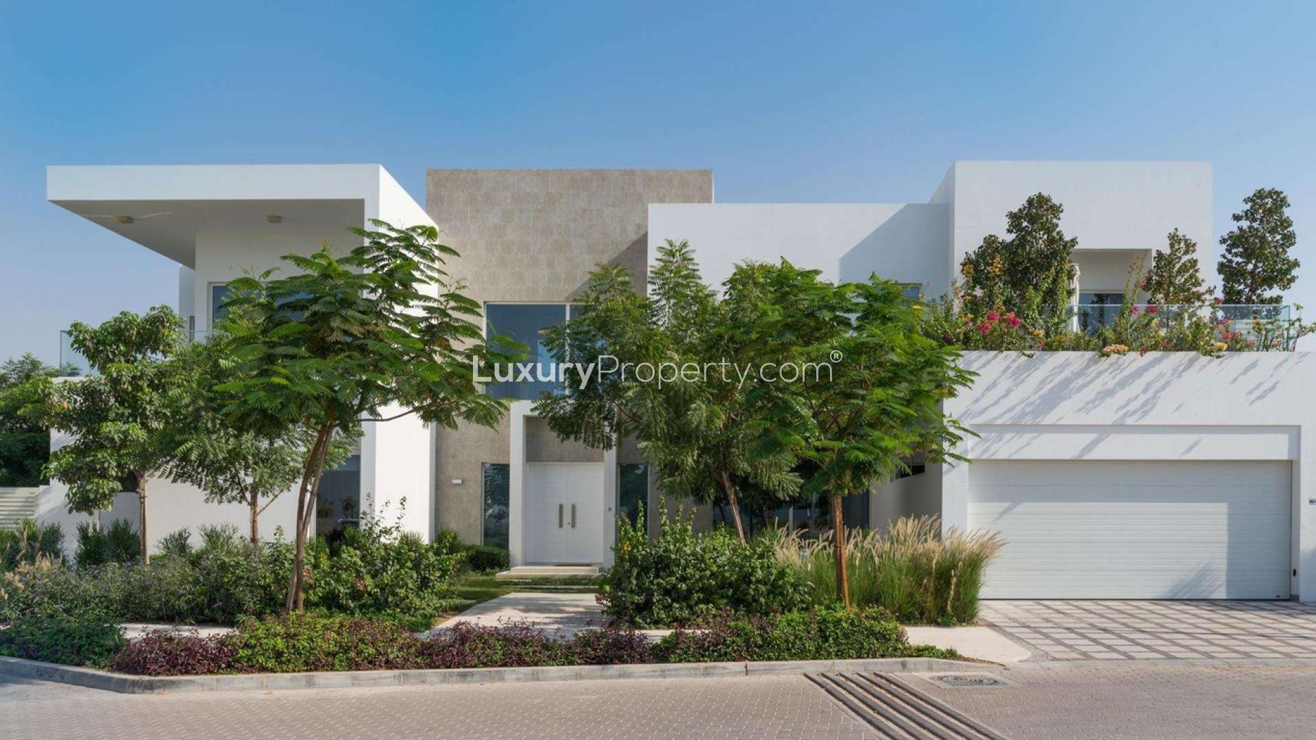 Modern four-bedroom villa exterior at The Nest, Al Barari, surrounded by lush greenery