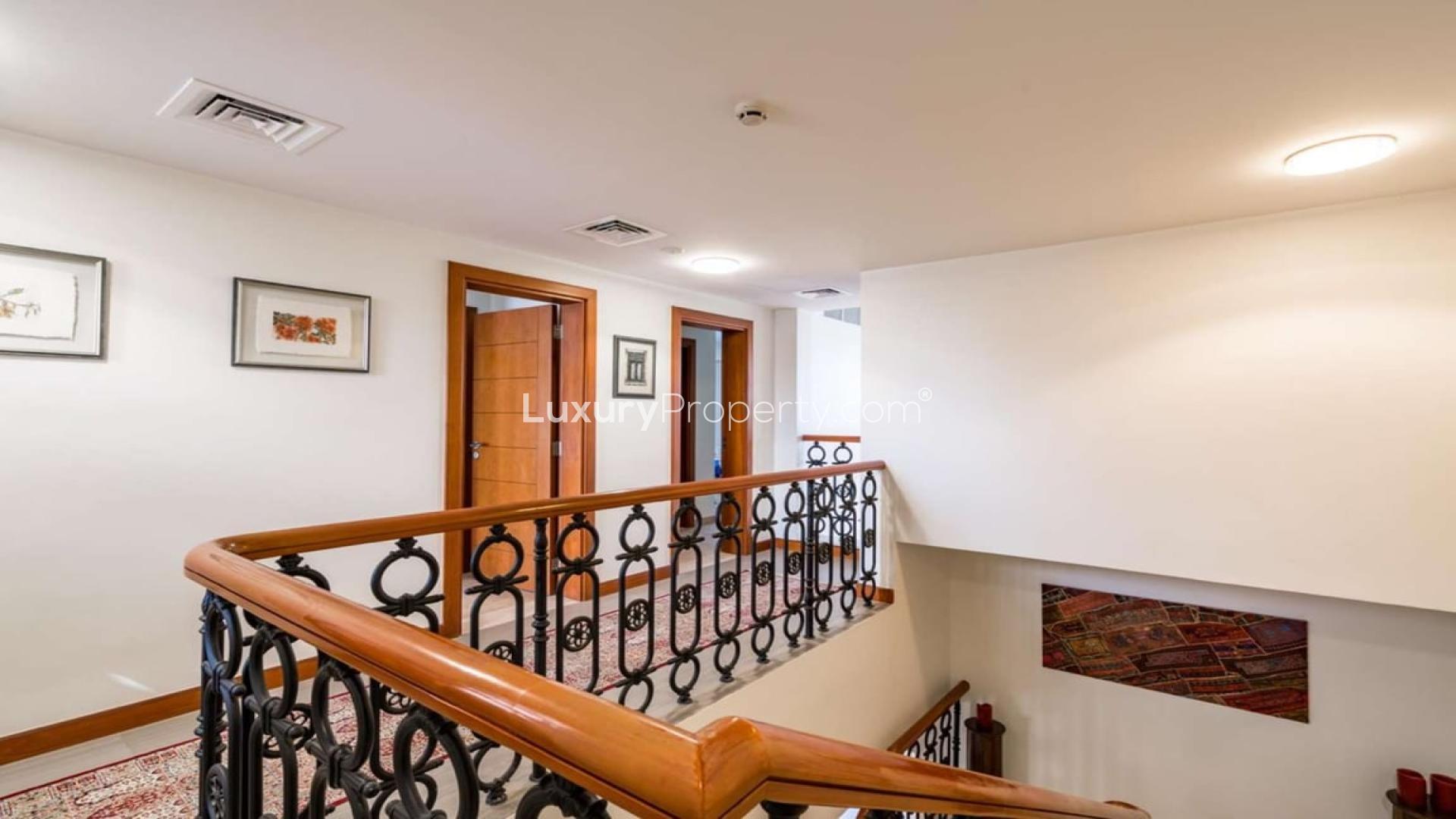 Exceptional Firestone-style villa exterior at Whispering Pines, Jumeirah Golf Estates for rent