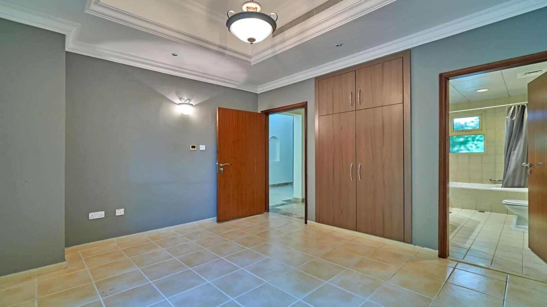 Spacious interior of luxury villa in Jumeirah Islands, featuring elegant marble flooring