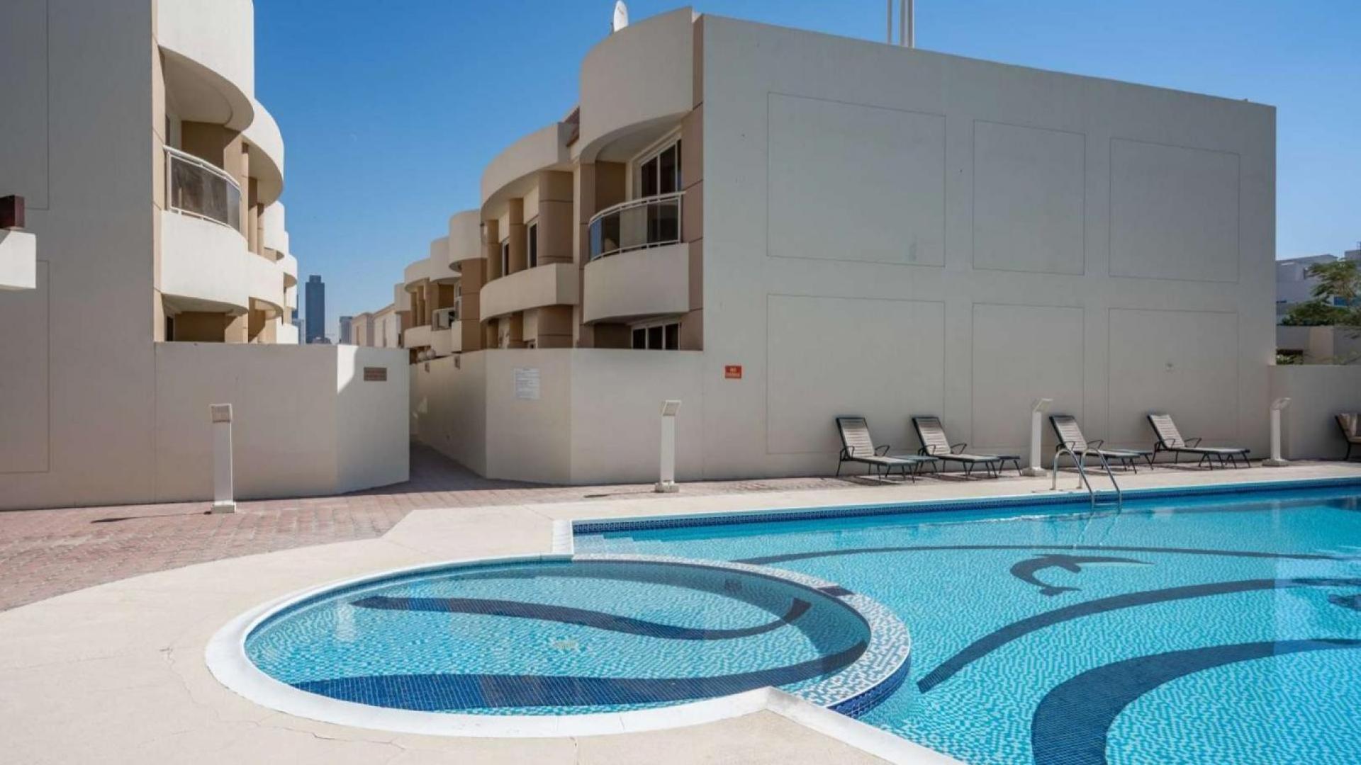 "Modern villa in Al Wasl, Jumeirah 1 with private pool for rent, 4 bedrooms.",Outdoor pool area at 4-bedroom villa for rent in Al Wasl, Jumeirah 1