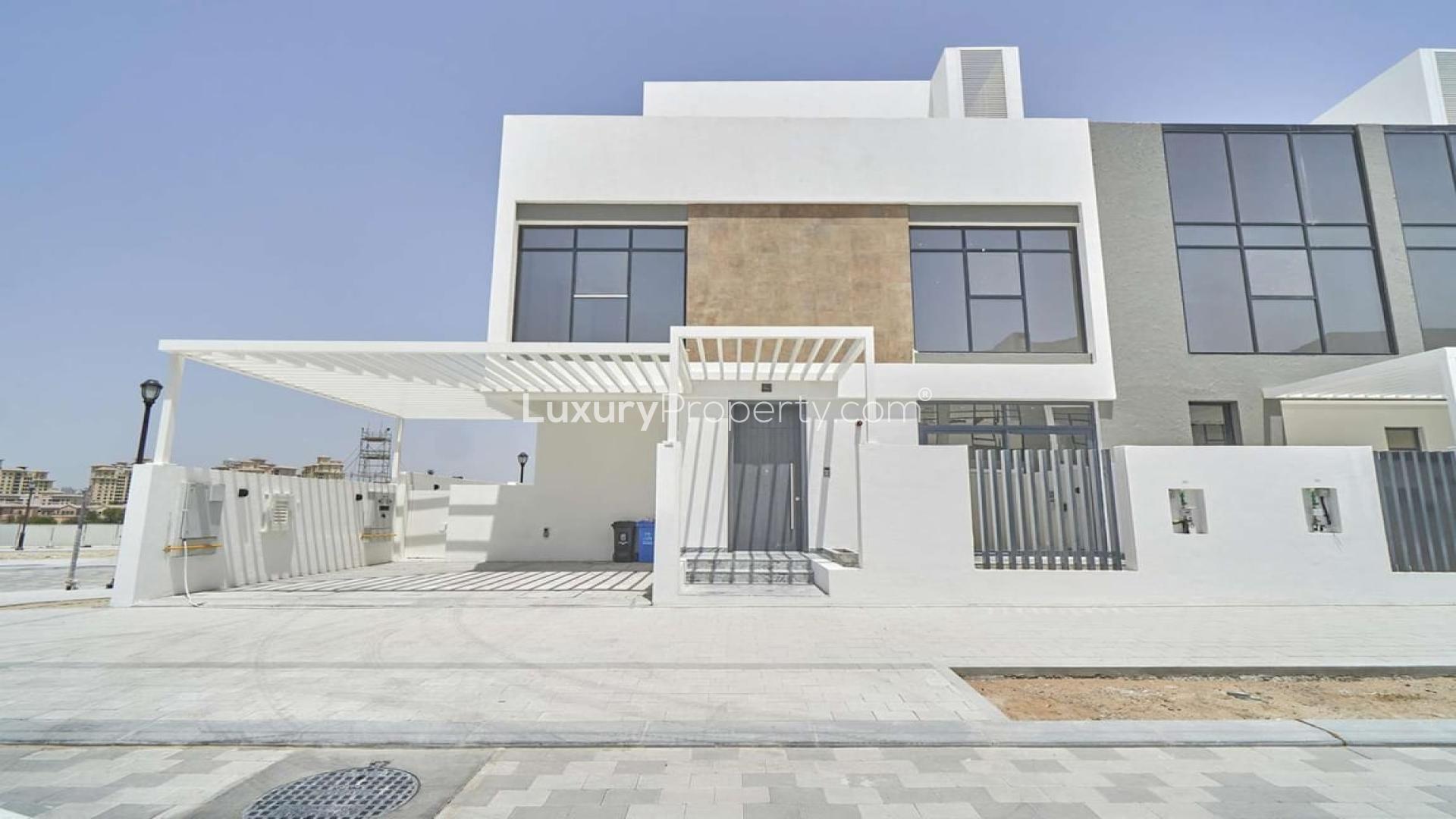 Modern villa interior with large windows, open kitchen in Jumeirah Golf Estates, available for rent
