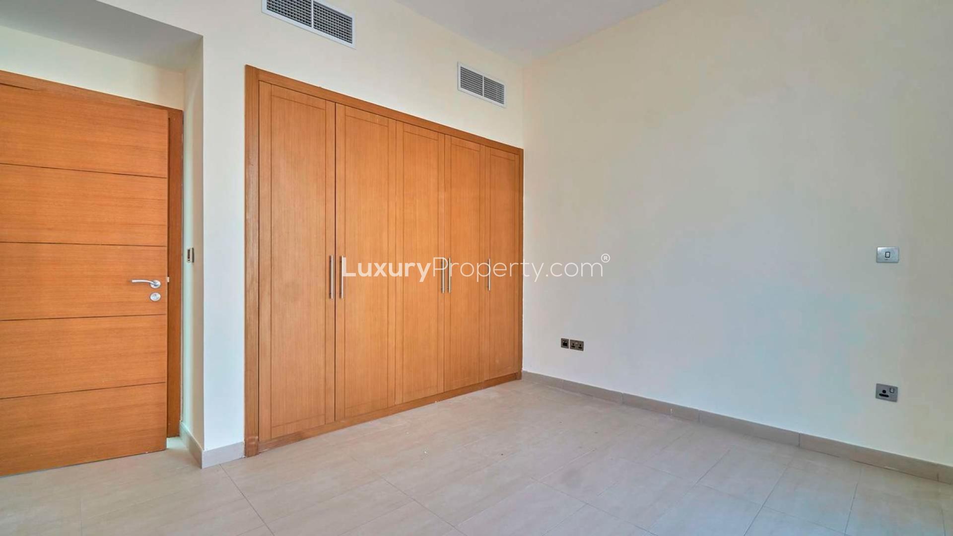 Front view of Legacy Nova Villa for rent in Jumeirah Park with garden and garage