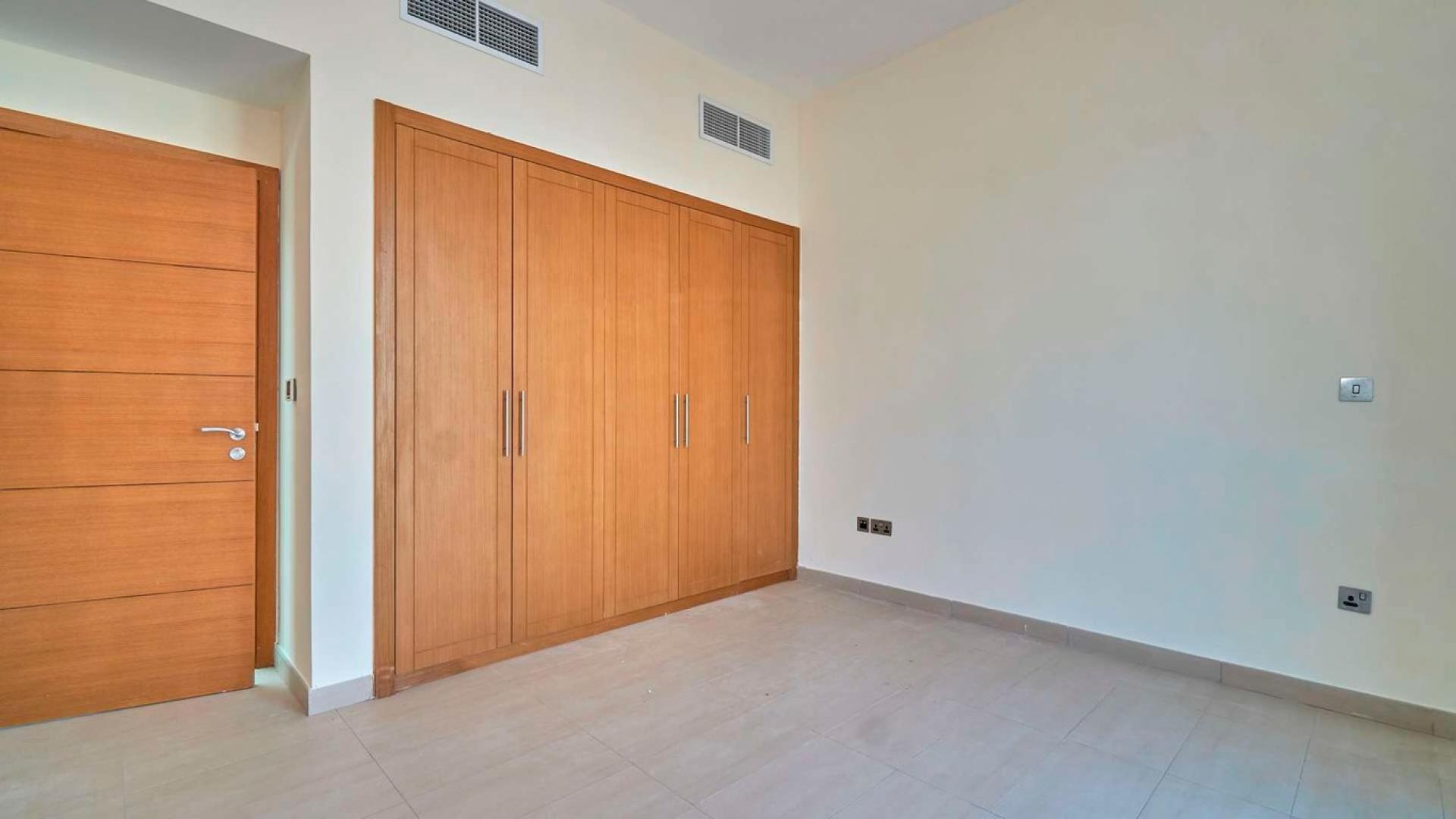 Front view of Legacy Nova Villa for rent in Jumeirah Park with garden and garage