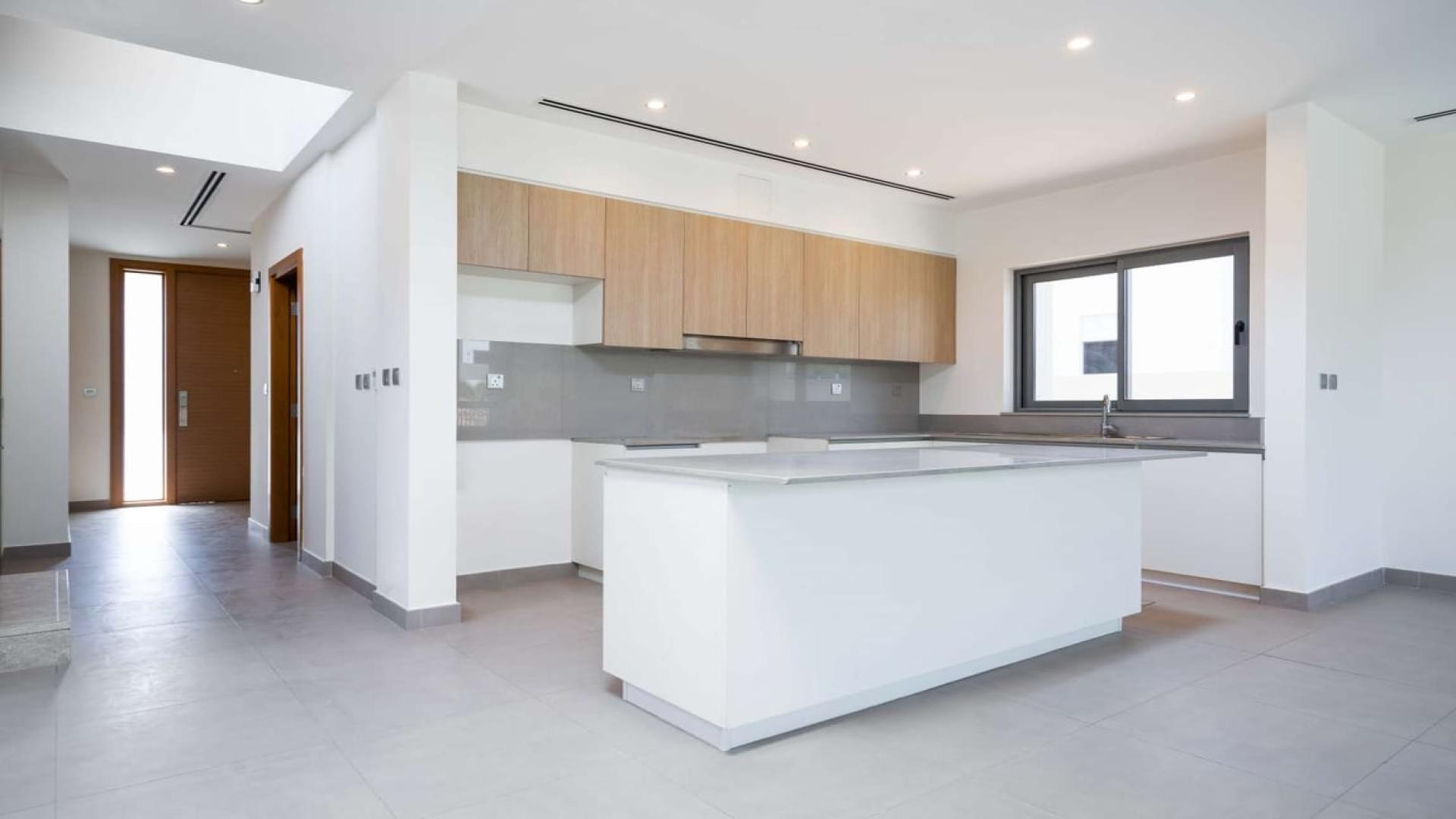 Modern four-bedroom villa exterior with garden in Dubai Hills Estate, Sidra Villas