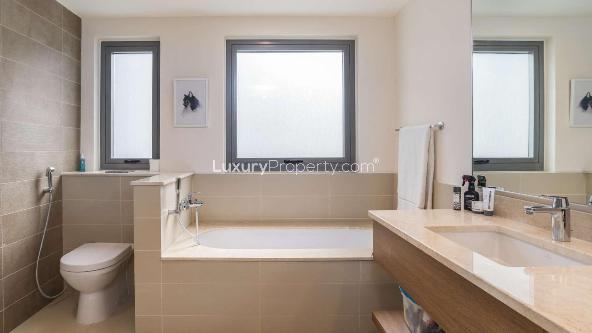 Modern bathroom in 4-bedroom Sidra villa, Dubai Hills Estate, featuring bathtub and sleek fixtures