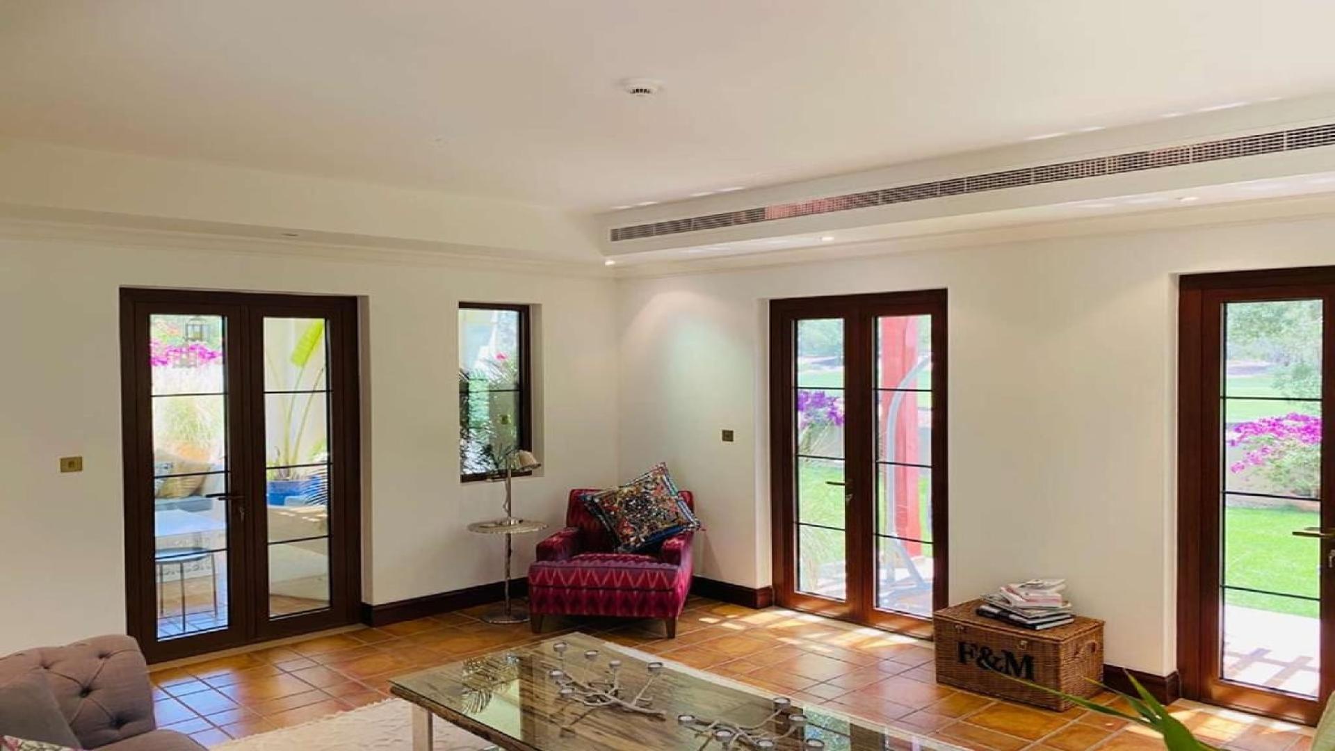 Zaragoza Villa exterior in Jumeirah Golf Estates, Earth community, with lush landscaping