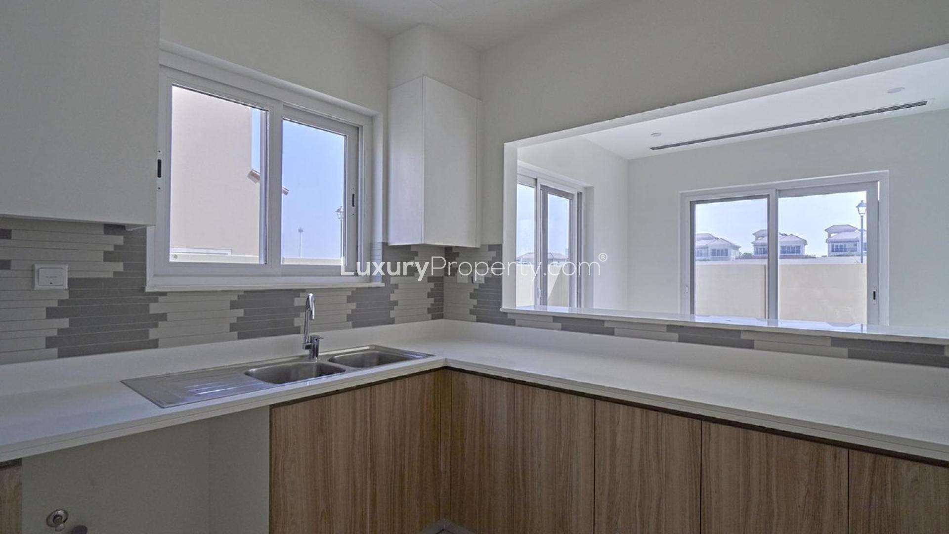 Modern open-plan kitchen and staircase in 4-bedroom villa, Amaranta, Villanova, Dubai