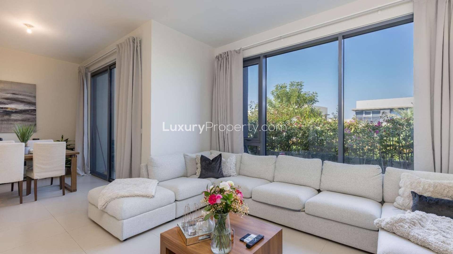 Modern dining area in 4-bedroom townhouse, Maple, Dubai Hills Estate, with garden view