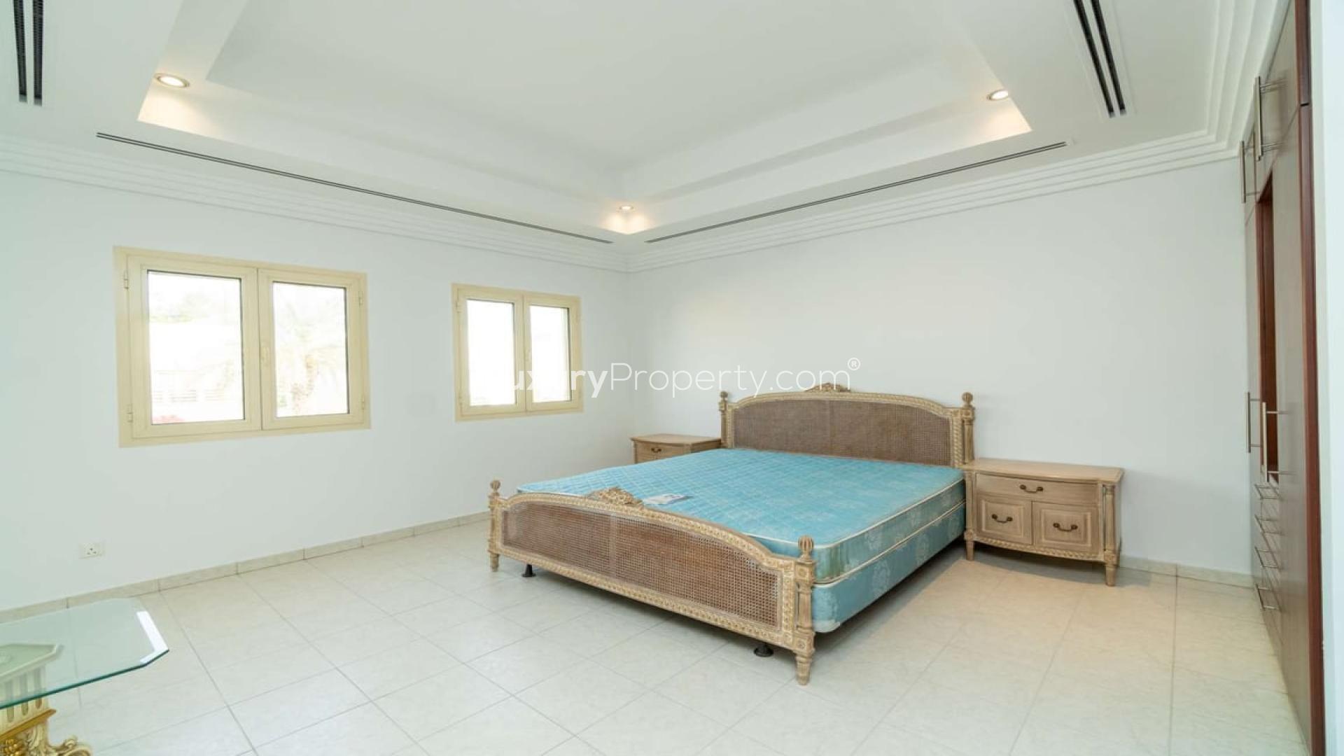 Lake view with vibrant garden path in Meadows 7 villa community for rent