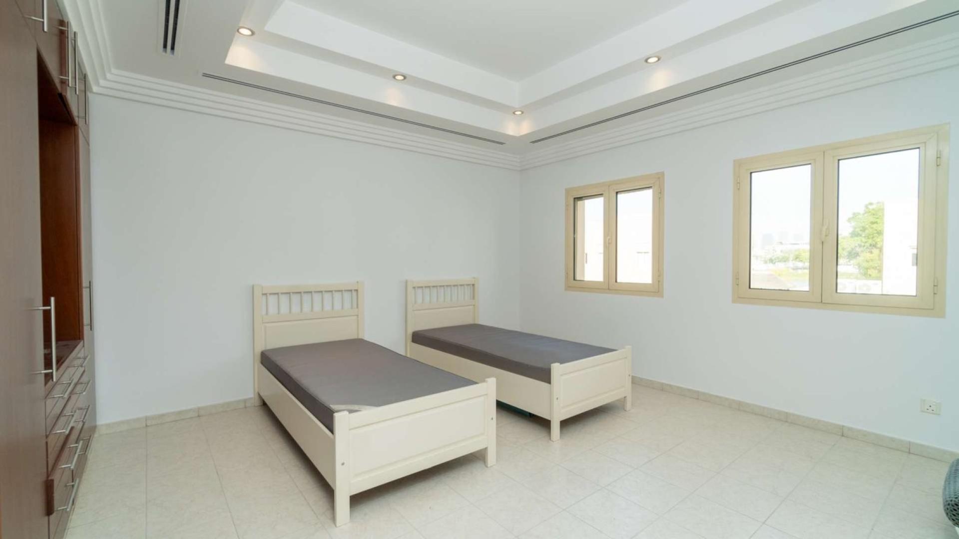 "Balcony with serene lake view in Meadows 7 villa for rent, Dubai.","Spacious bedroom with twin beds in Meadows 7 villa, available for rent.",Villa for rent in Meadows 7 with spacious courtyard, four bedrooms, five bathrooms