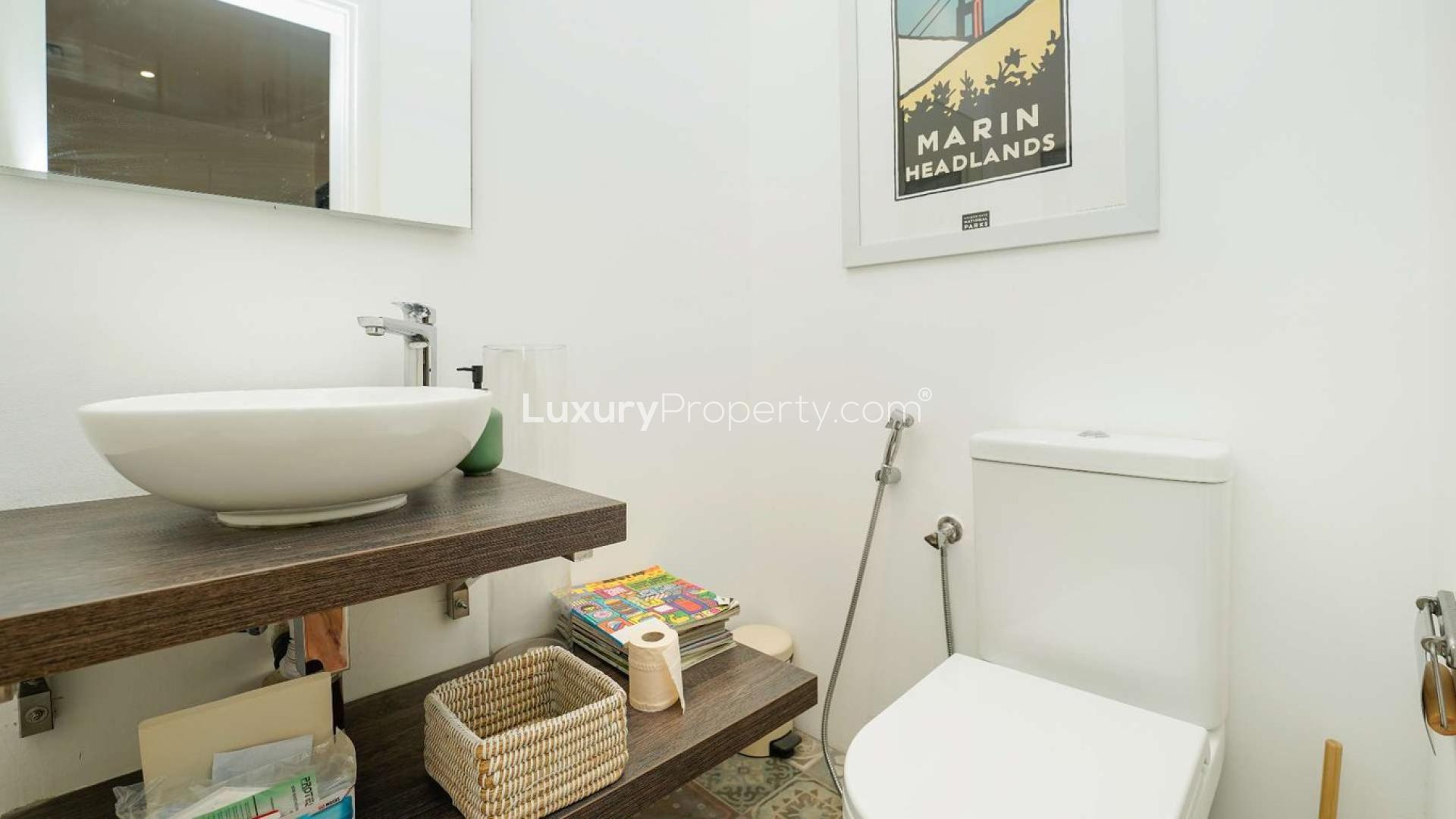 Living room in fully upgraded villa, Meadows 6, with modern furnishings and large windows