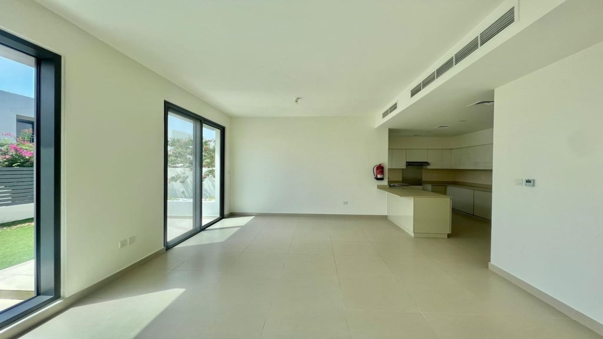 Empty living room with large windows, Dubai Hills Estate villa for rent