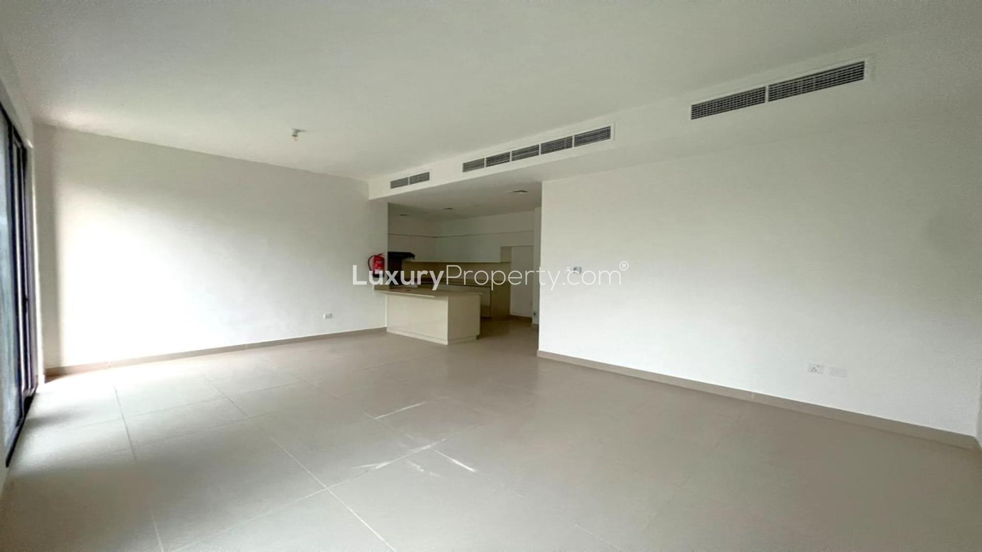 Spacious villa interior with large windows overlooking garden in Dubai Hills Estate