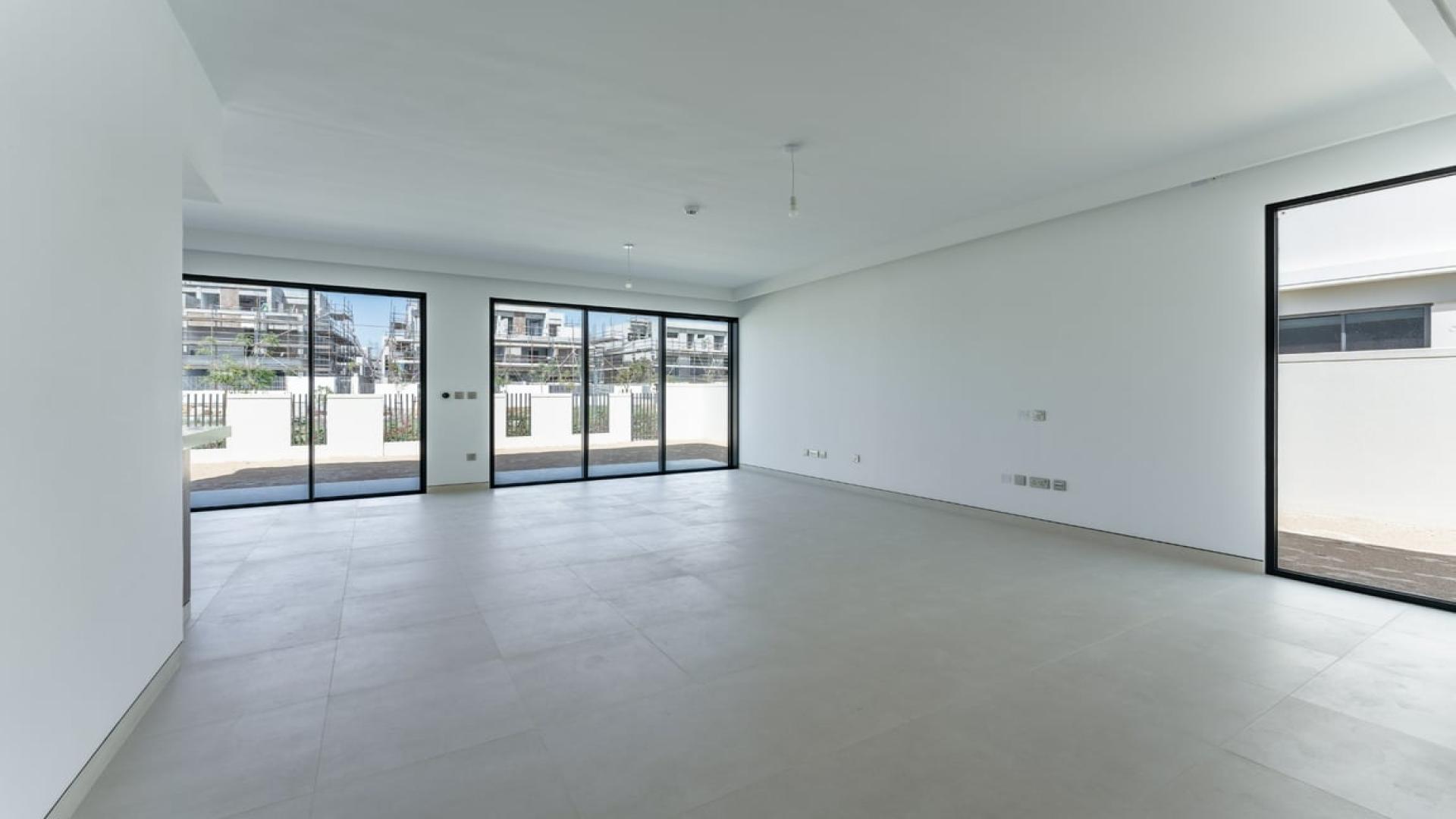 Modern villa exterior with spacious patio in Harmony, Tilal Al Ghaf, available for rent