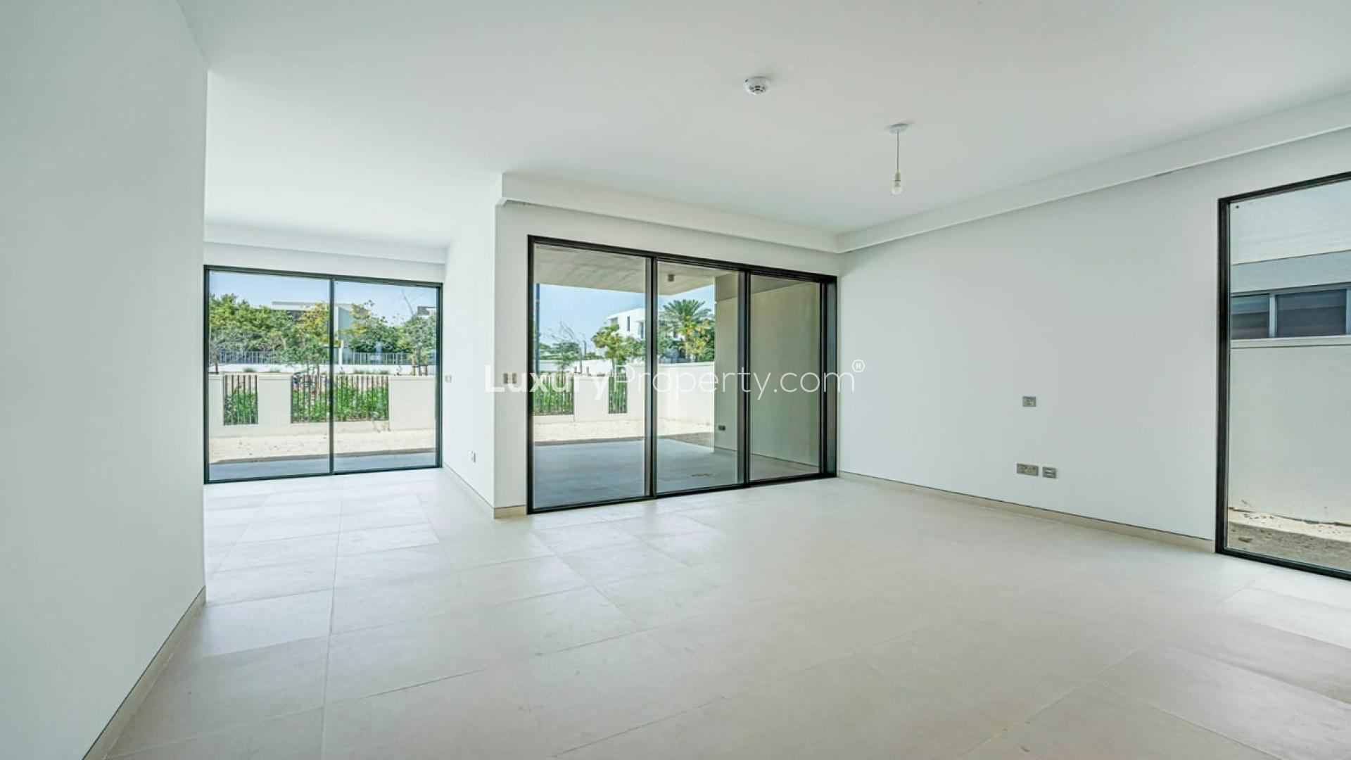 Vacant villa interior with large windows in Harmony, Tilal Al Ghaf community