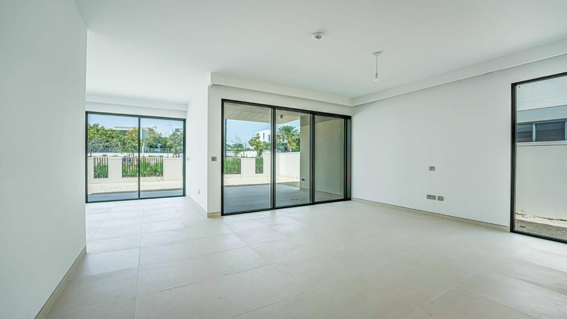 Vacant villa interior with large windows in Harmony, Tilal Al Ghaf community
