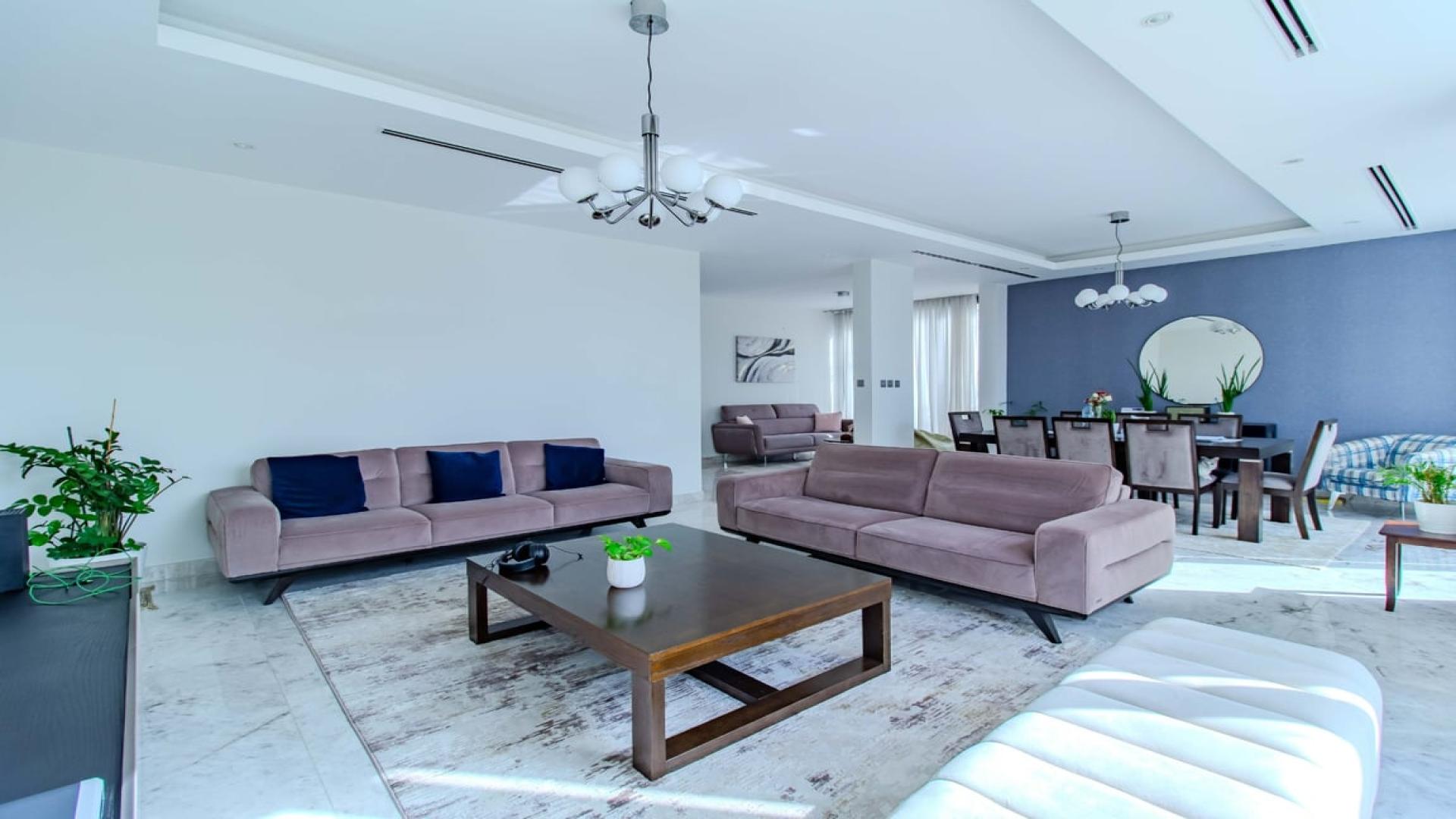 Modern living room in upgraded 4-bedroom villa, Sidra, Dubai Hills Estate, with garden view