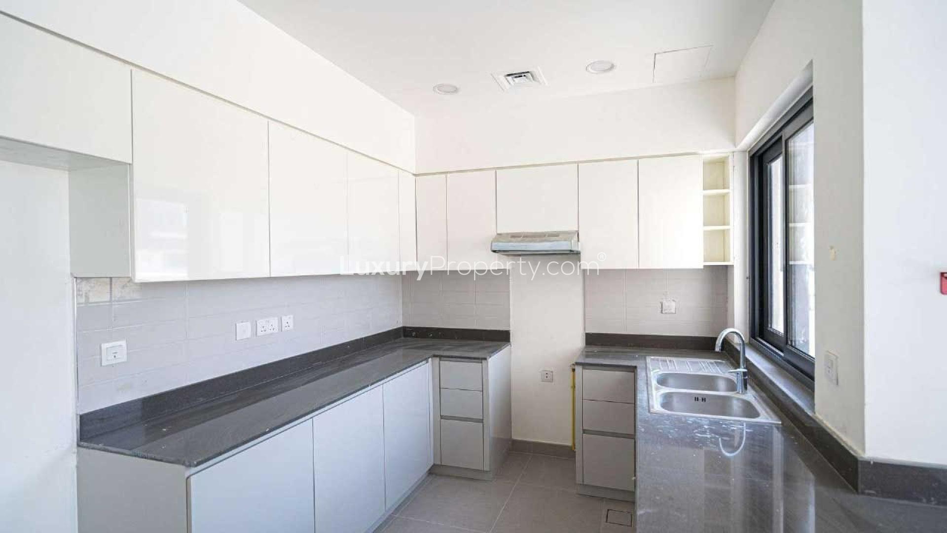 Modern kitchen and living area in 4-bedroom villa, Maple 1, Dubai Hills Estate