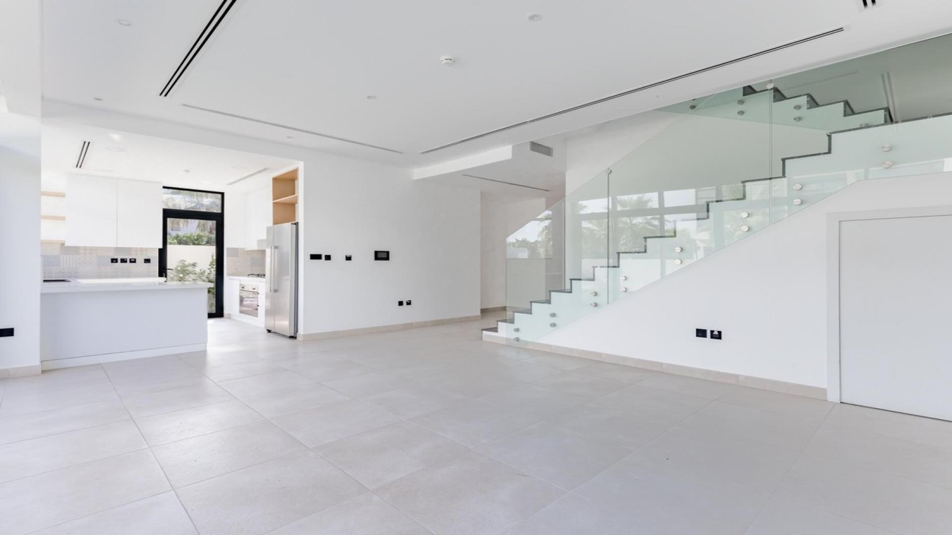 Modern villa interior with glass staircase in Jumeirah Luxury, Jumeirah Golf Estates