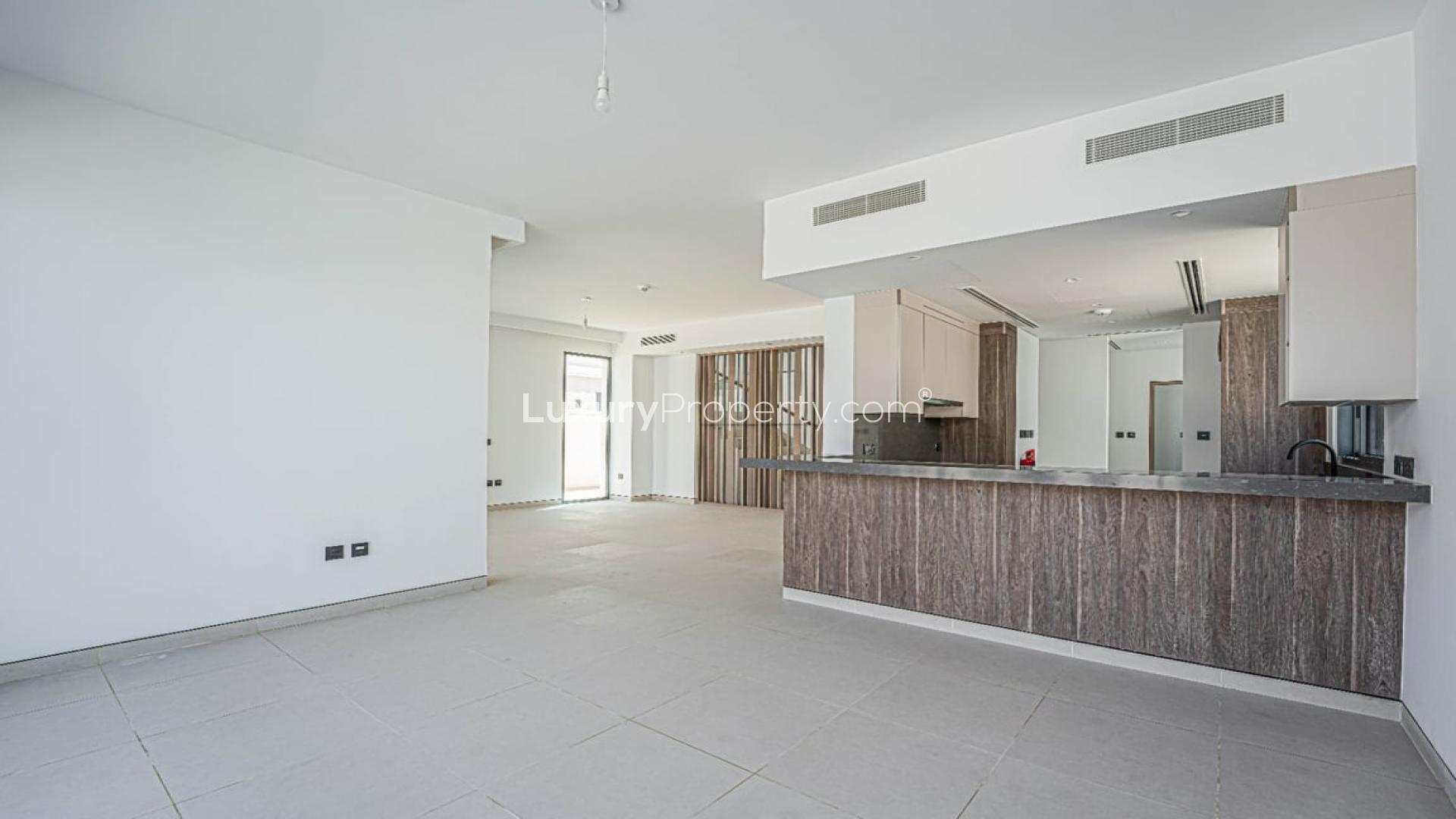 Spacious living area with large windows in Harmony Villa, Tilal Al Ghaf for rent