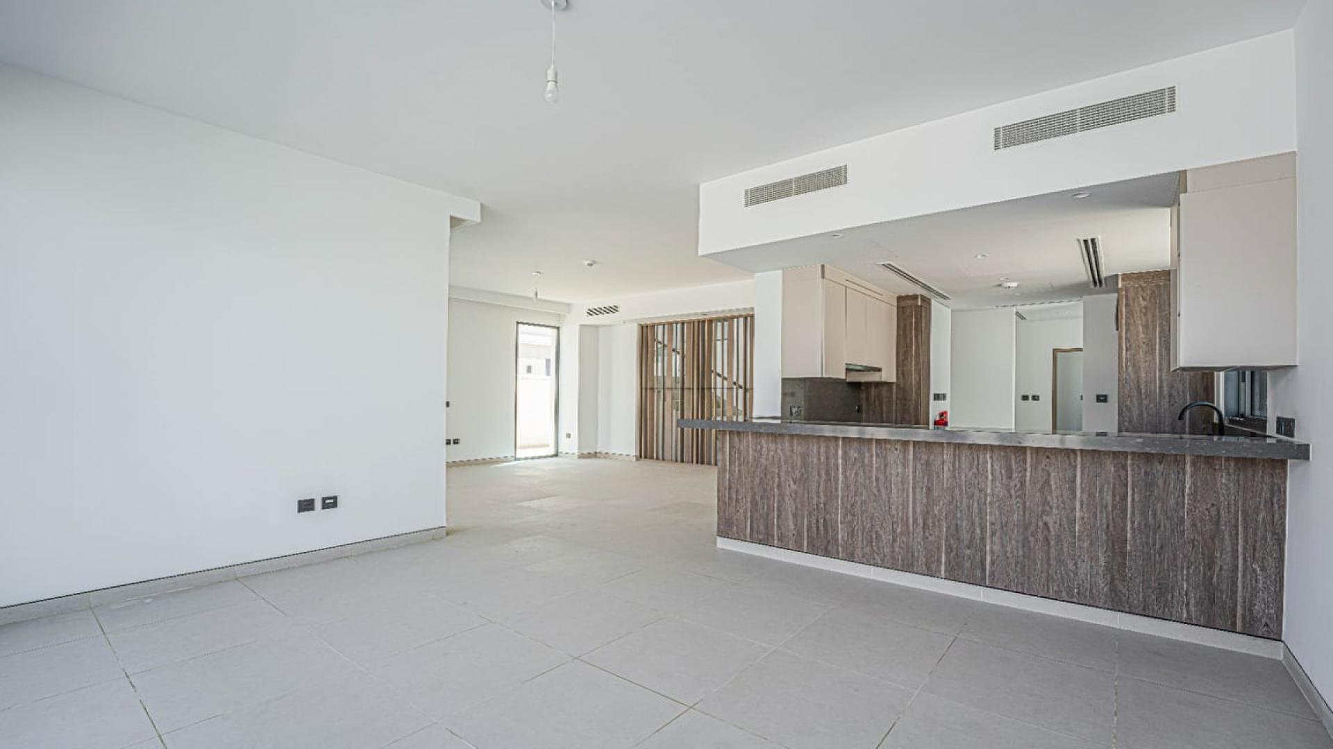 Spacious living area with large windows in Harmony Villa, Tilal Al Ghaf for rent