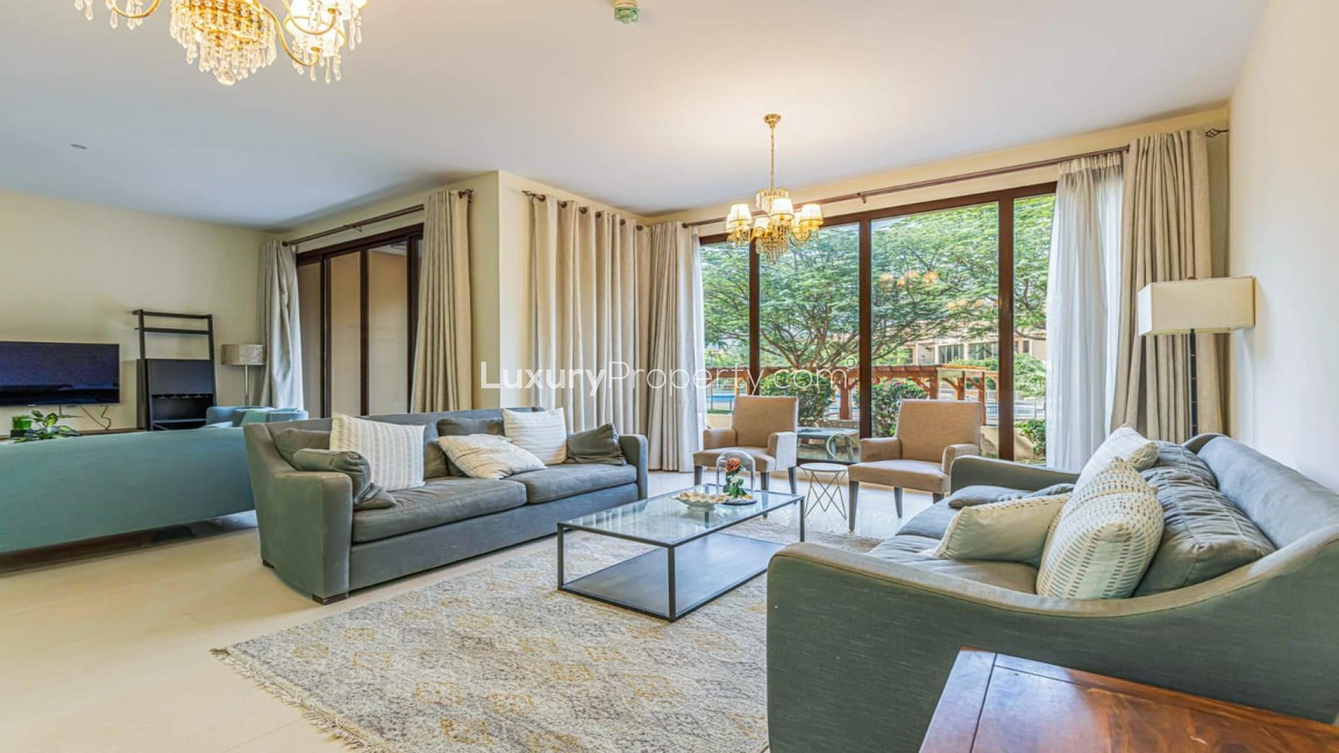 Furnished villa exterior with garden, Jumeirah Islands Townhouses, next to pool, for rent