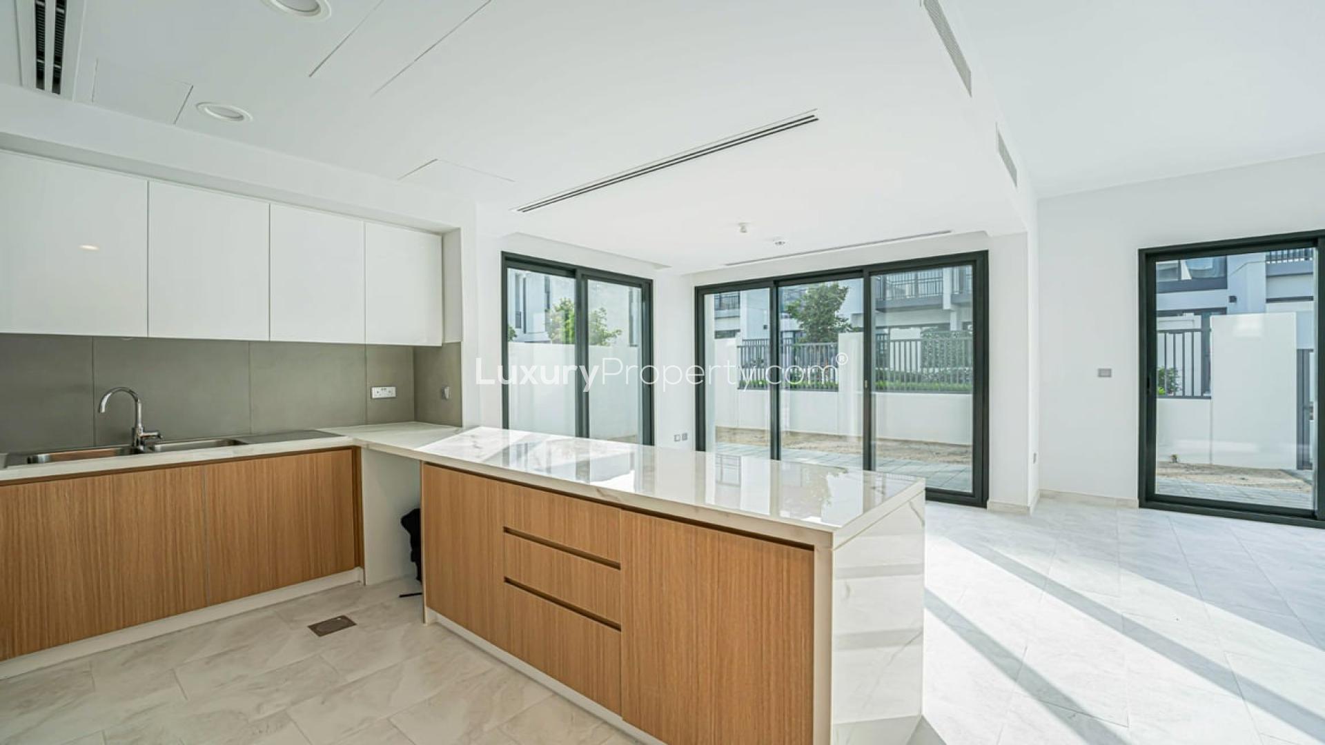 Spacious living room with large windows in Villanova villa for rent, Dubai Land