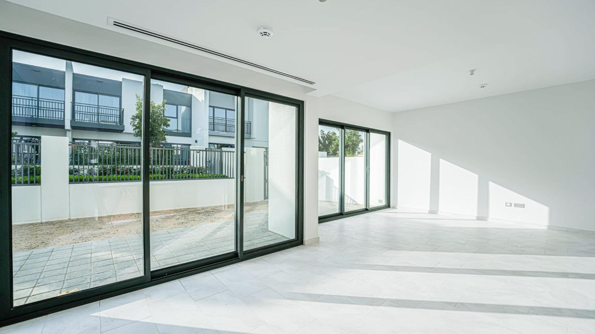 Exterior view of vacant villa with patio in Villanova, Dubai Land for rent