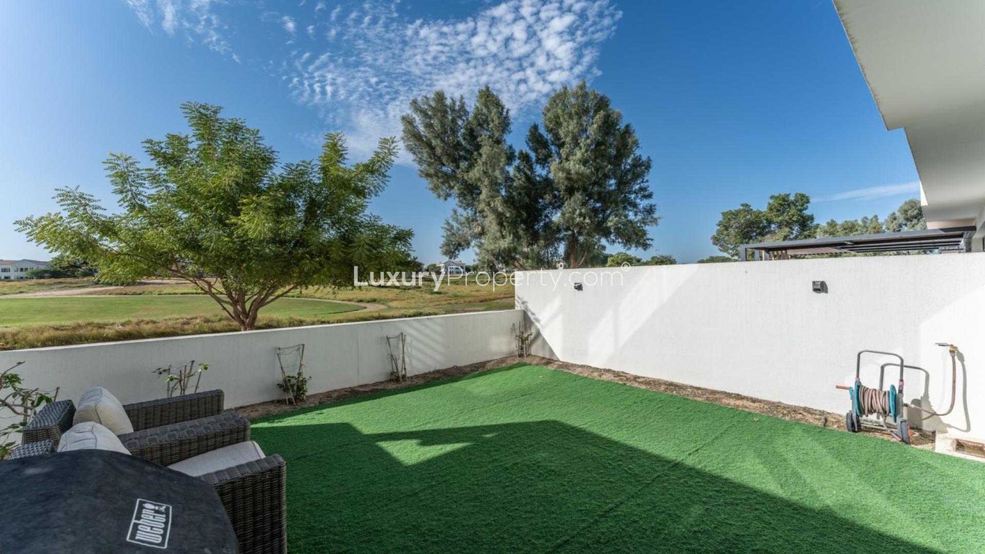 Contemporary villa living room with large windows, modern furniture, near Earth Golf Course