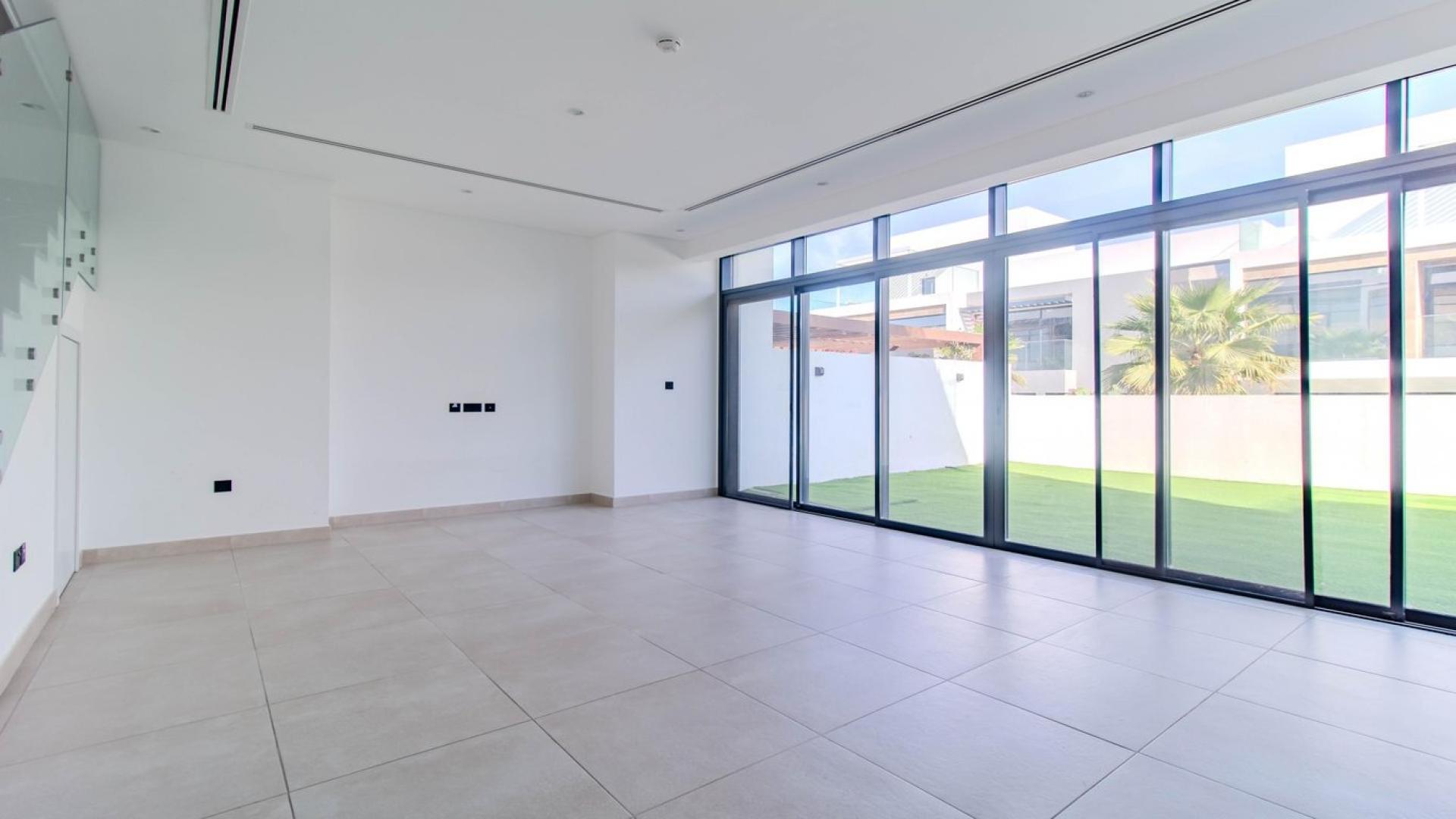 Modern open-plan villa interior with large windows in Jumeirah Golf Estates, Jumeirah Luxury