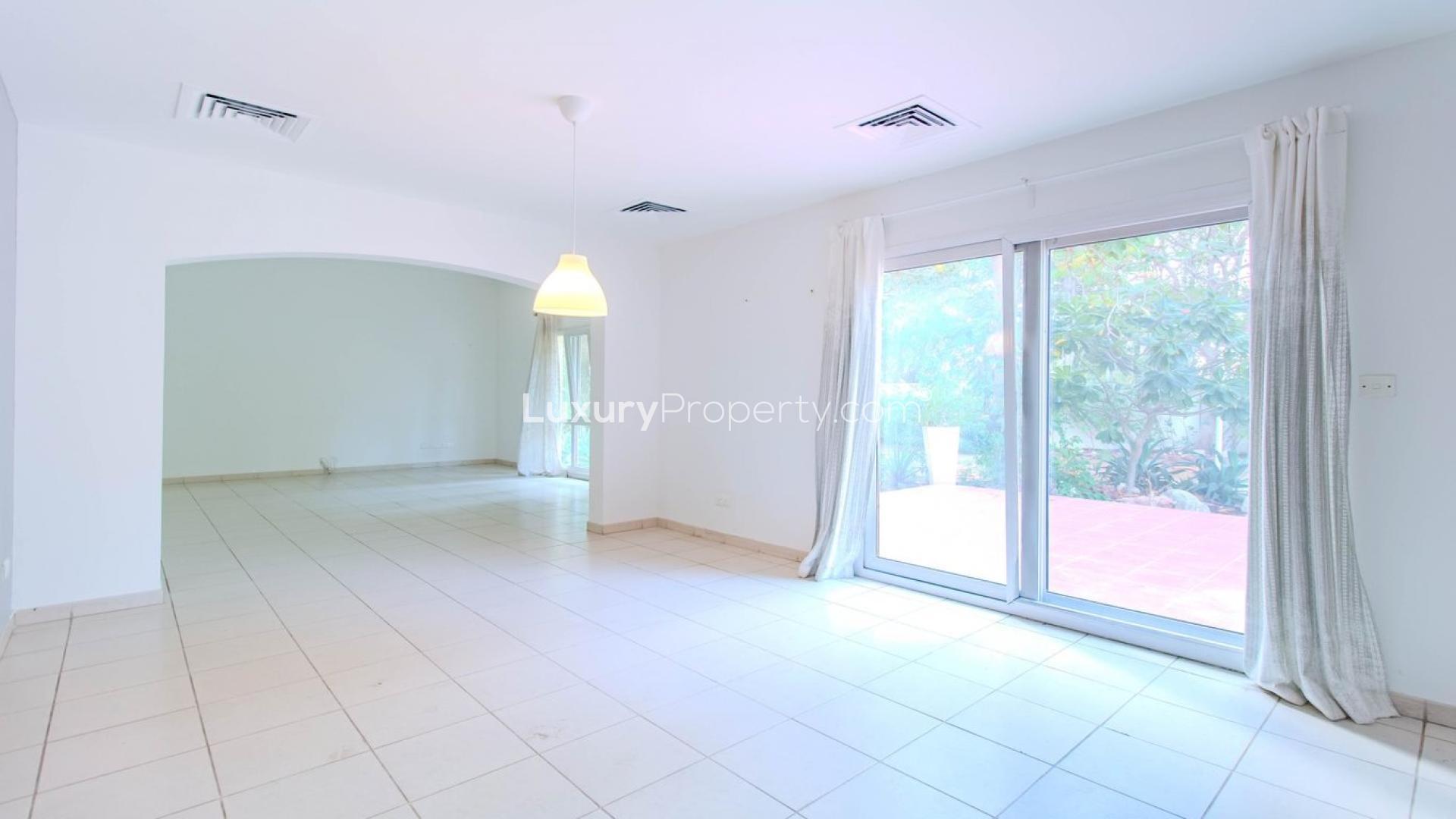 Terrace view of Meadows 9 villa with palm trees and landscaped surroundings