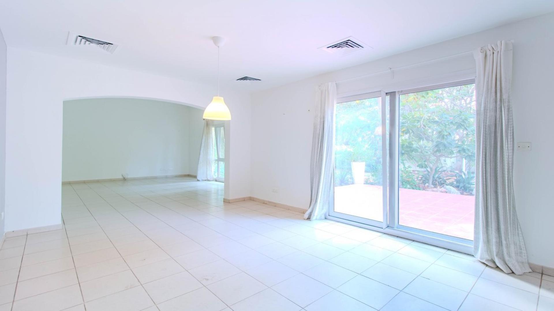 Terrace view of Meadows 9 villa with palm trees and landscaped surroundings